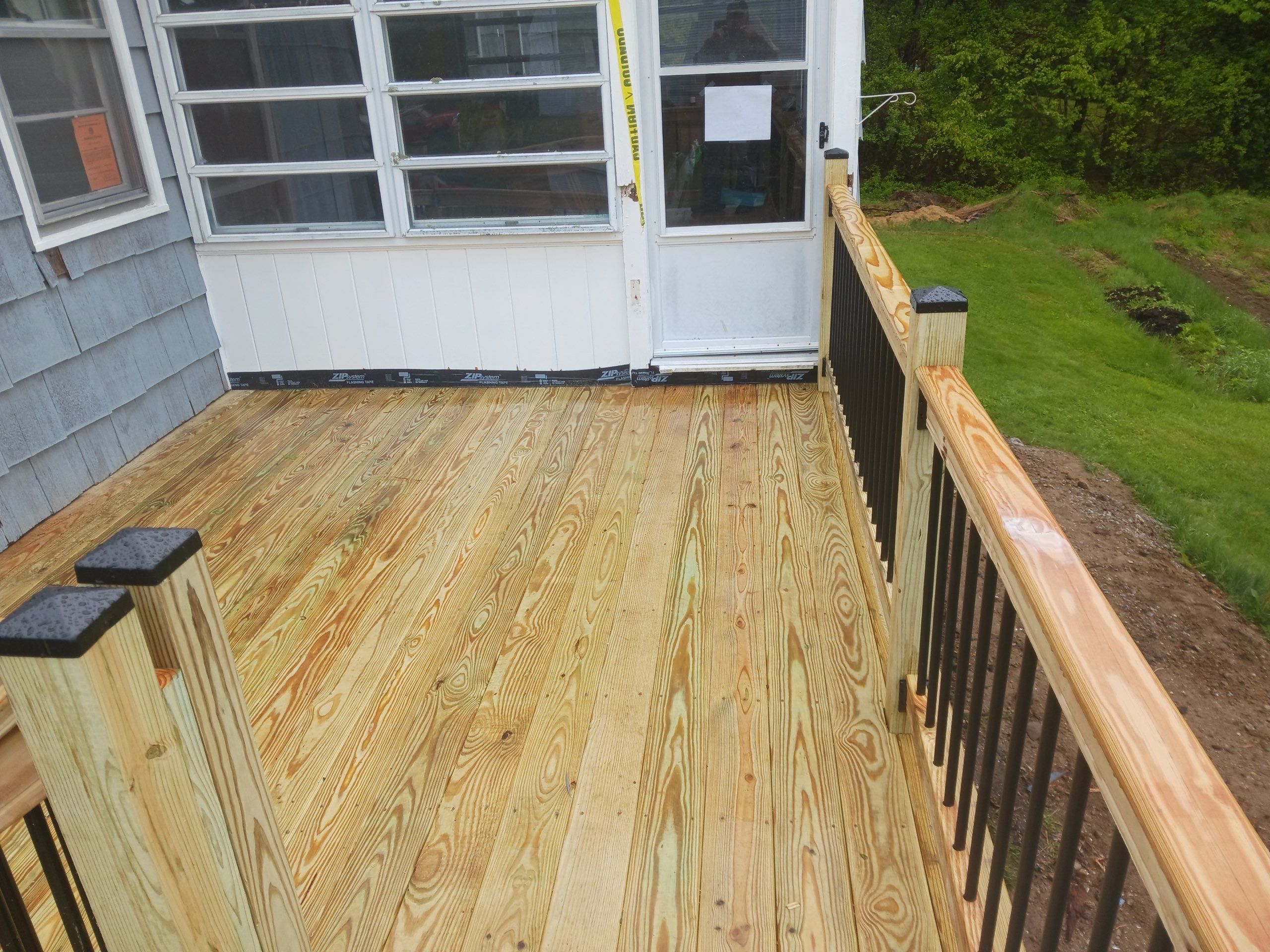 Moultonborough, NH – Pressure-Treated Deck Installation by Tall pine roofing