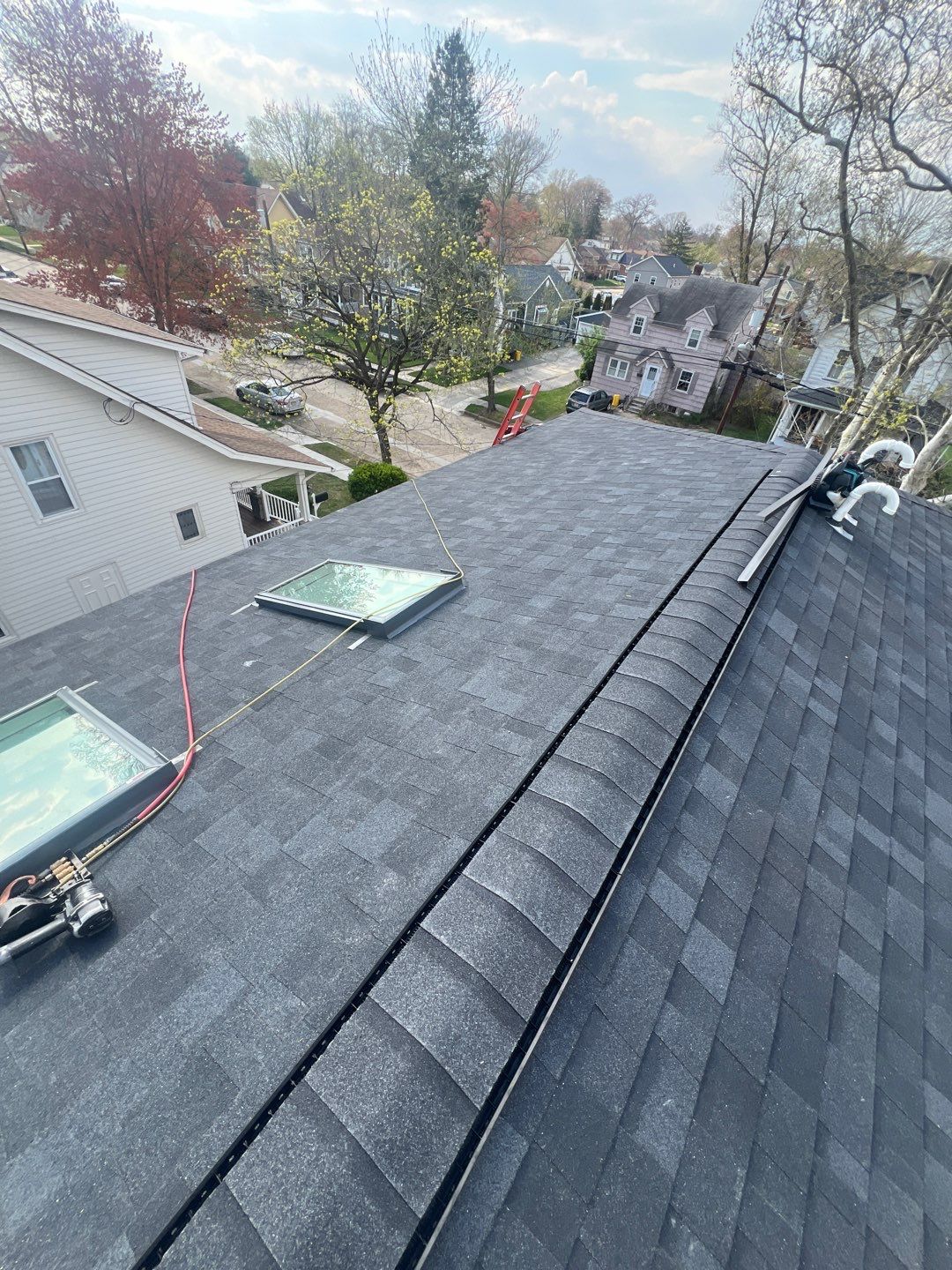 Moire Black Shingles by Reimagine Roofing
