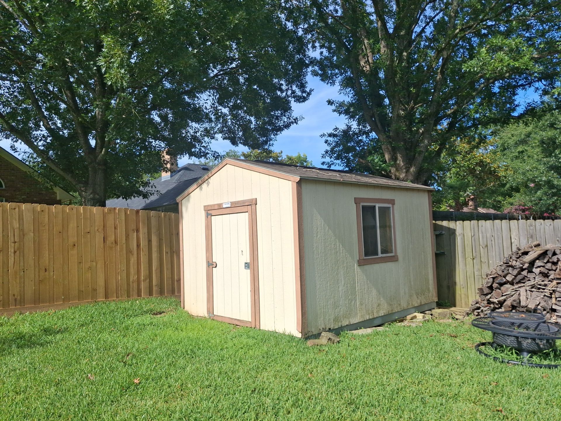 Project in TylerExterior Painting in Tyler, TX | White Brick Home, Varnished Fence & Shed Painting by Quality Coats Painting