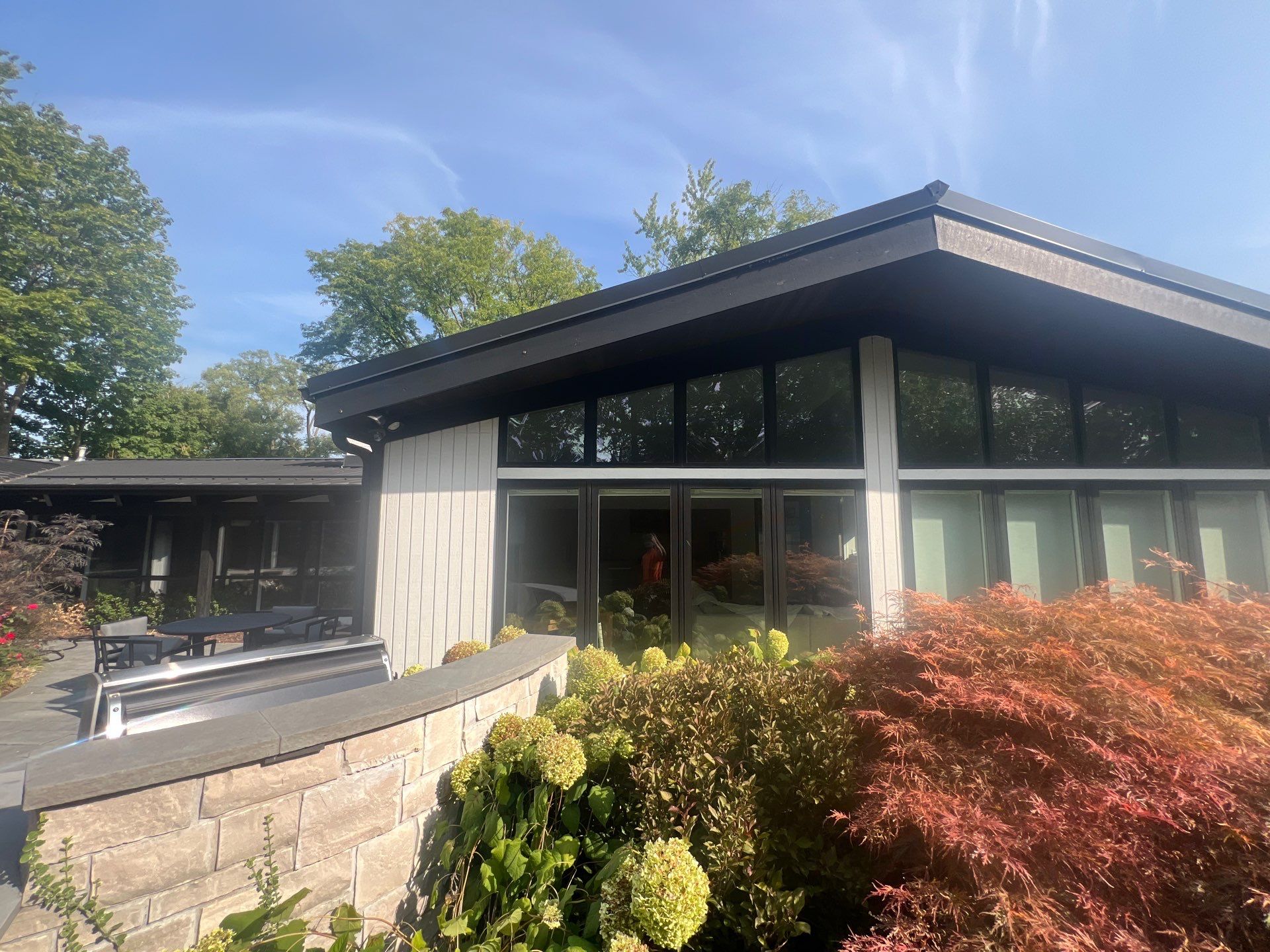 Complete Exterior House, Bluestone & Garage Floor Cleaning by Northern Power Washing LLC.