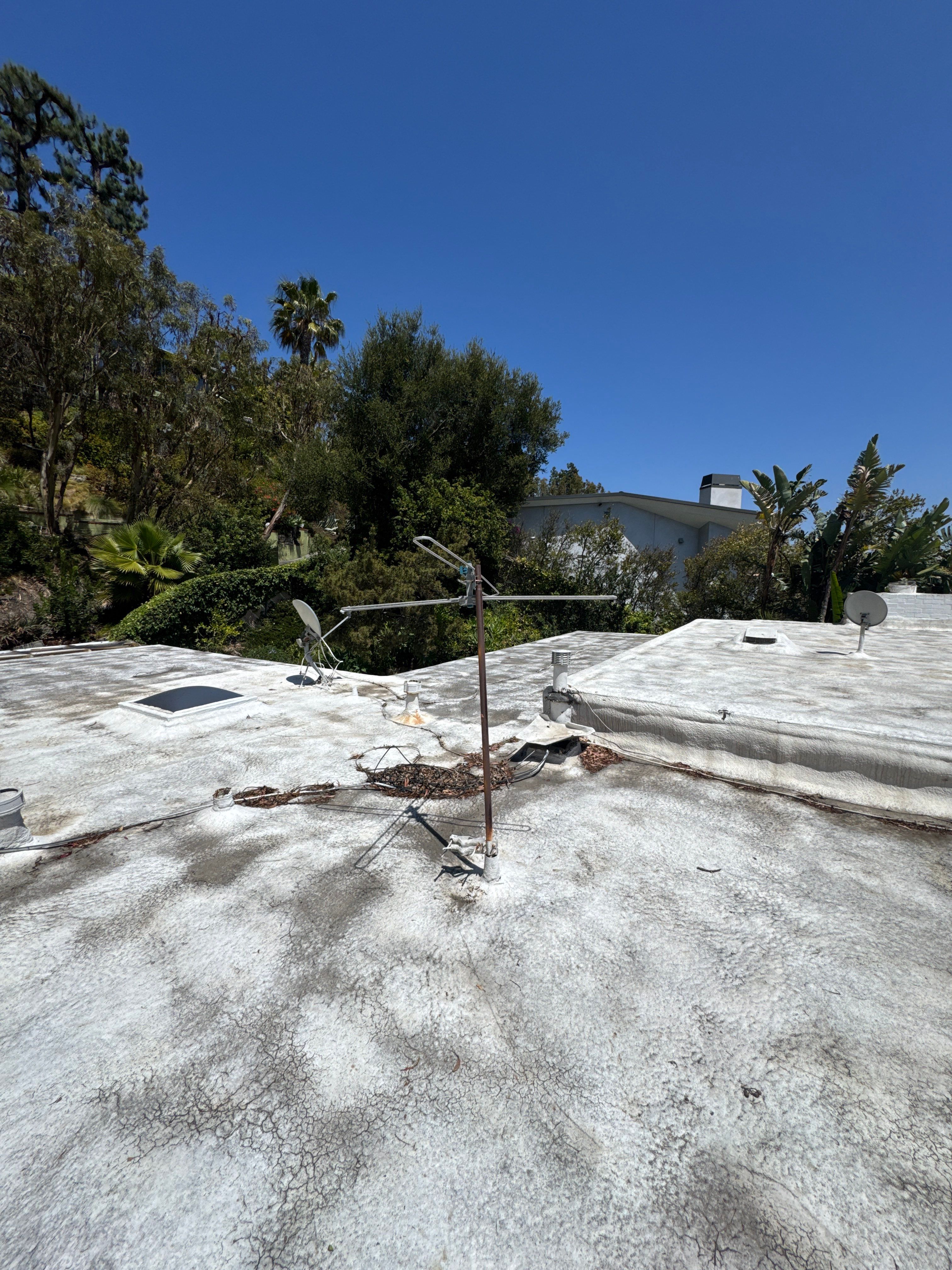 Residential Flat Roof Restoration with Silicone Coating in Brentwood by Hull Brothers Roofing