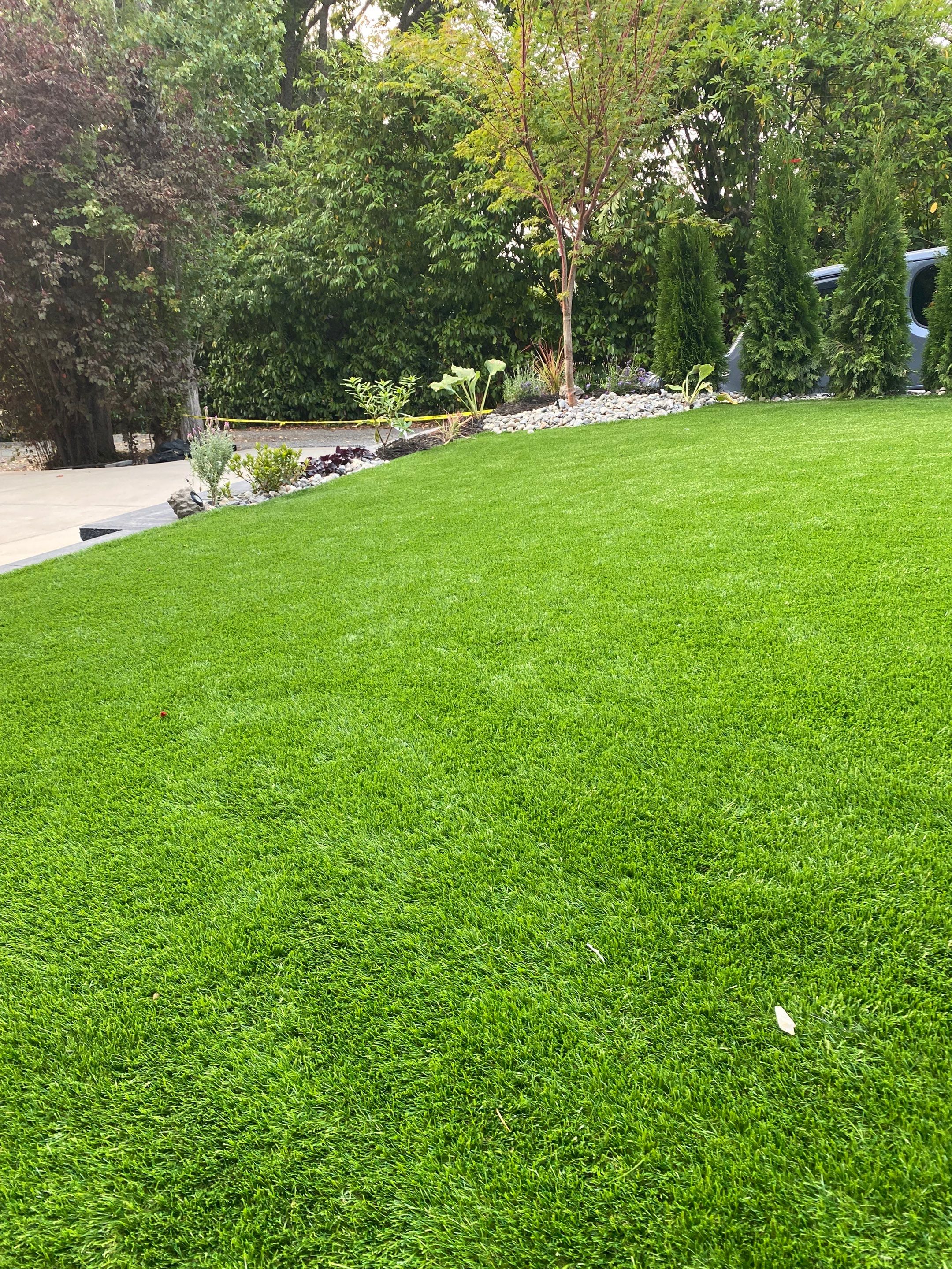 Patio Installation using Concrete, Retaining walls, and Turf install by Jireh Asphalt & Concrete Inc 