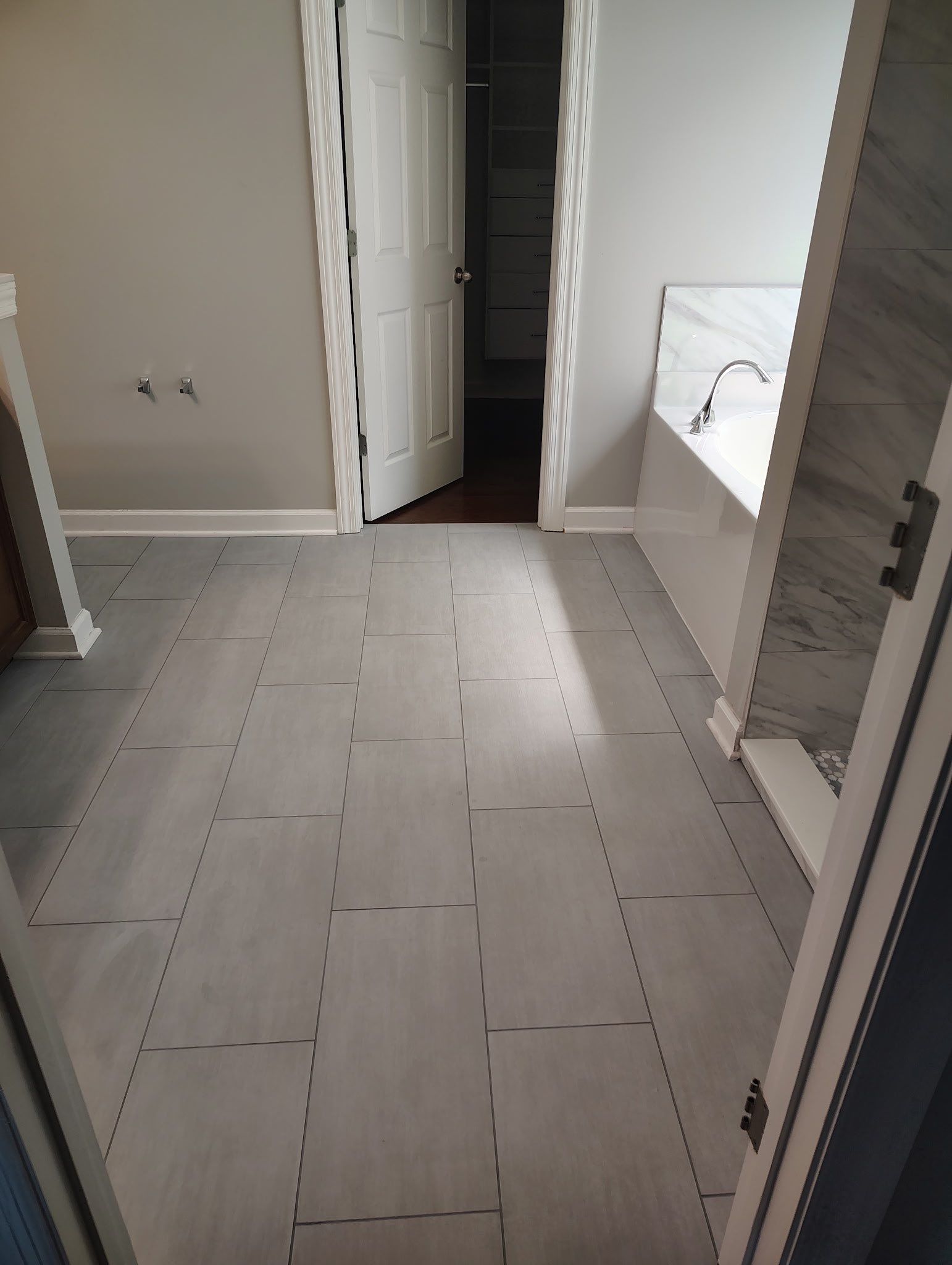 Tile shower remodel and heated floors by Footprints Floors of Nashville