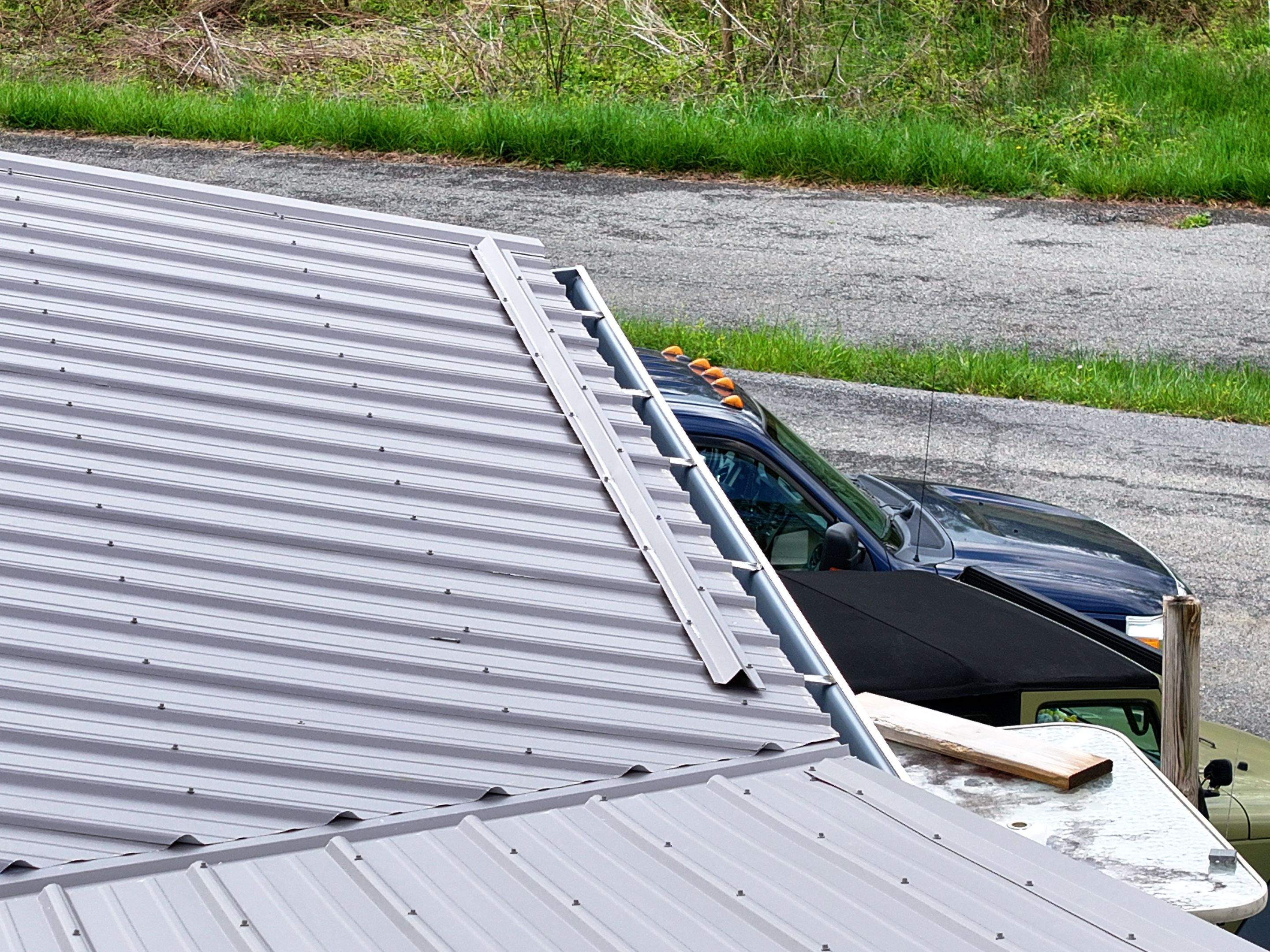 Charcoal Gray Textured Metal Roof by Omnia Roofing