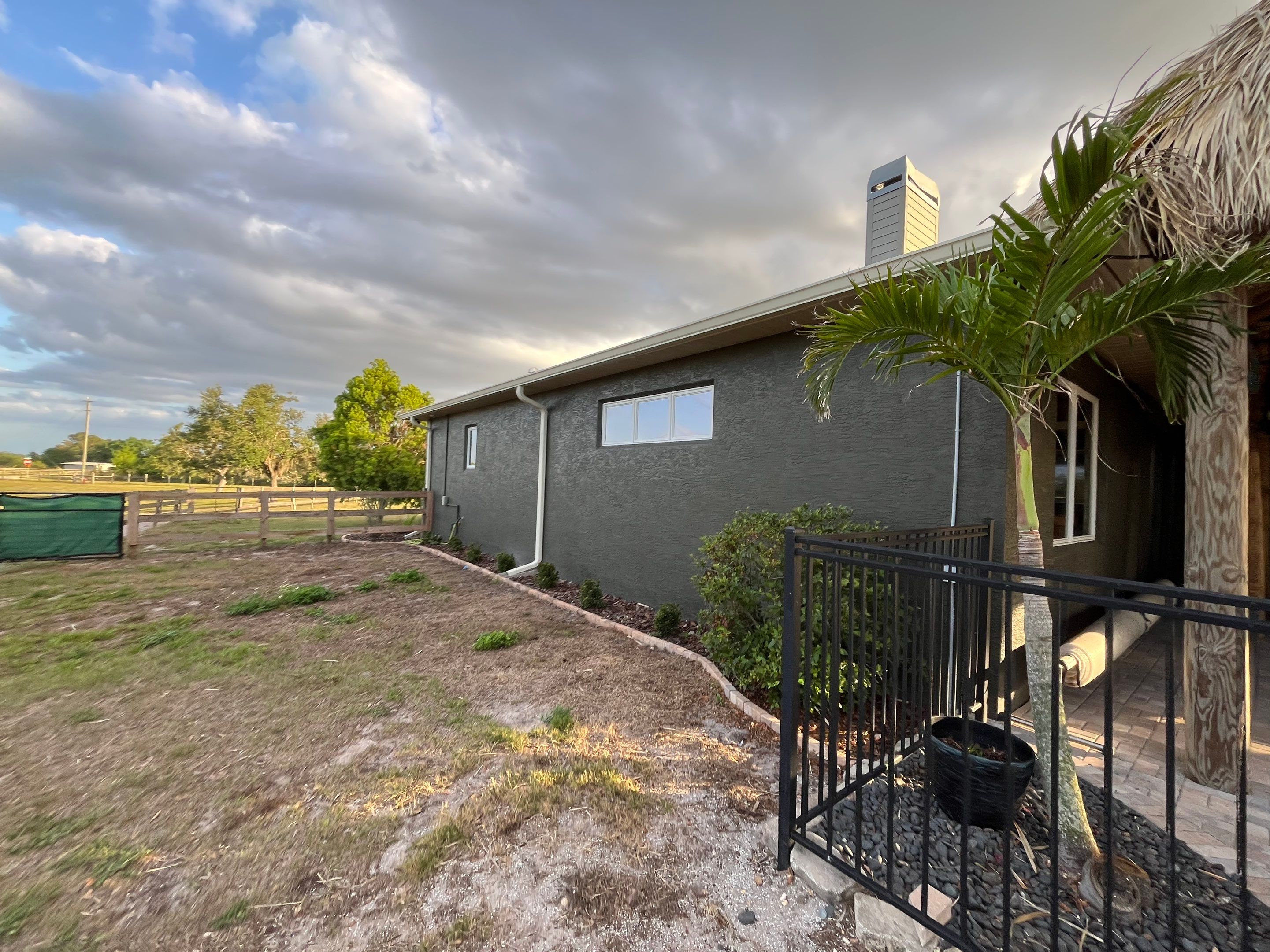  7-inch White seamless gutters and downspouts in Myakka City FL by Gutter Professors