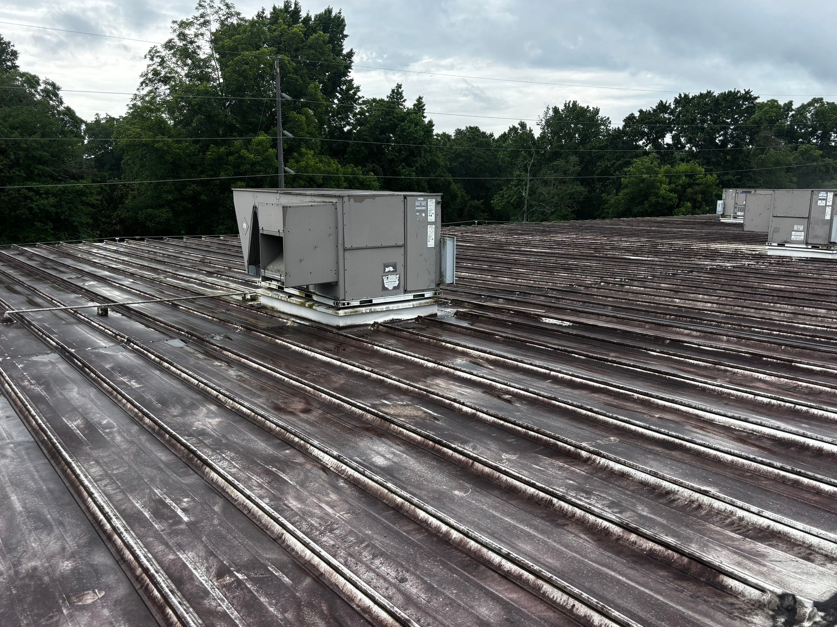 Commercial Metal Roof Restoration and Coating in Clarkston by Southern Roof Solutions