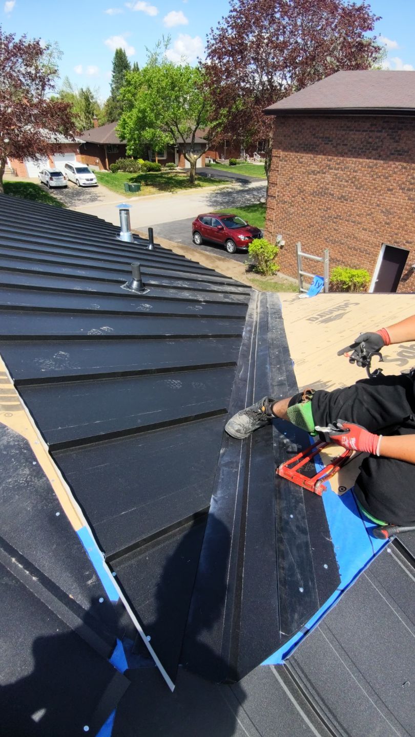 Residential Roofing Installation using 16" Standing Seam Panels by Jay Carter Roofing & Sheet Metal