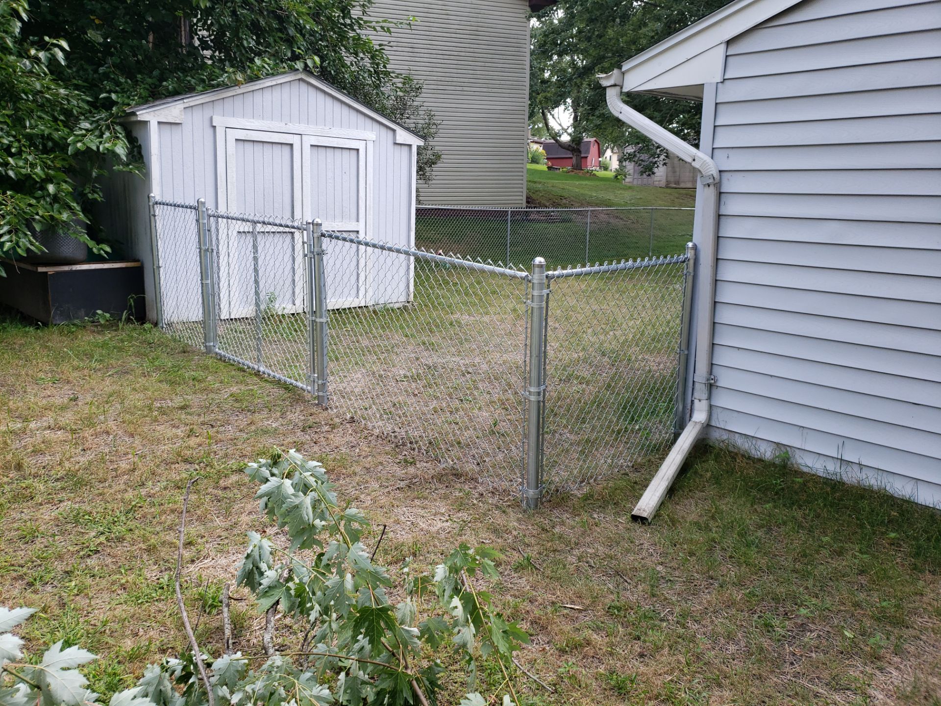Galvanized Chain Link Backyard Fence and Gate Installation in Cedar Falls by Perfect Picket Fence and Stain
