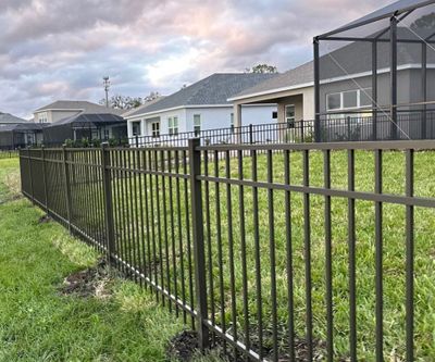 Aluminum Fence Installation using Black 3 Rail Aluminum Fence