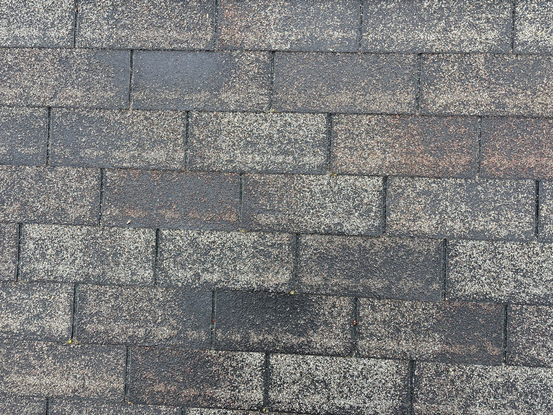 Installing new Roof and Gutter Protection after Hail Damage by Acme Exteriors
