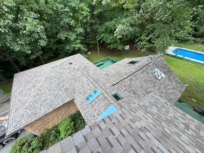 Comprehensive Architectural Shingle Roof Replacement and Skylight Installation in Laurel