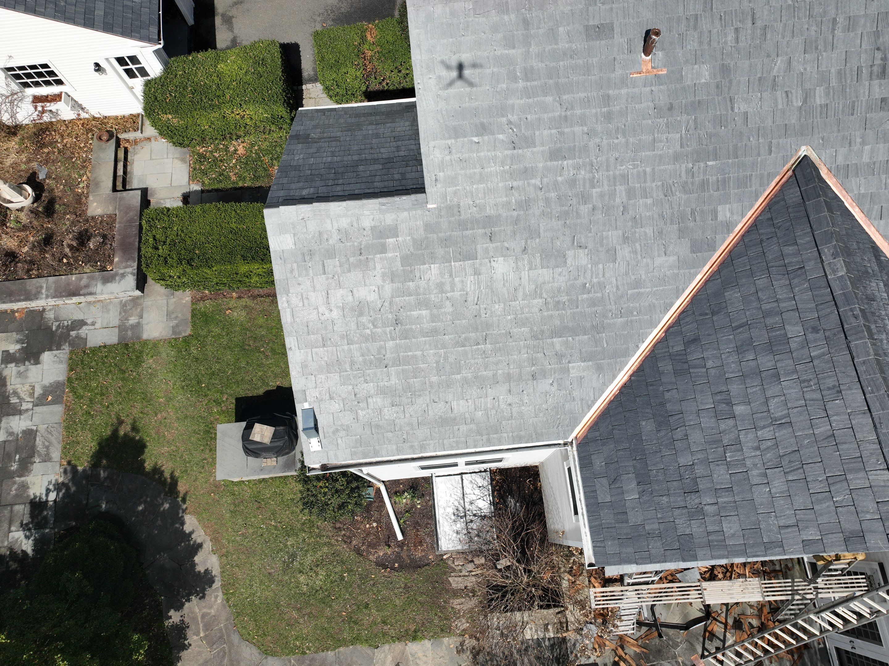 Residential Roofing Installation using Vermont Slate by A Plus Exterior