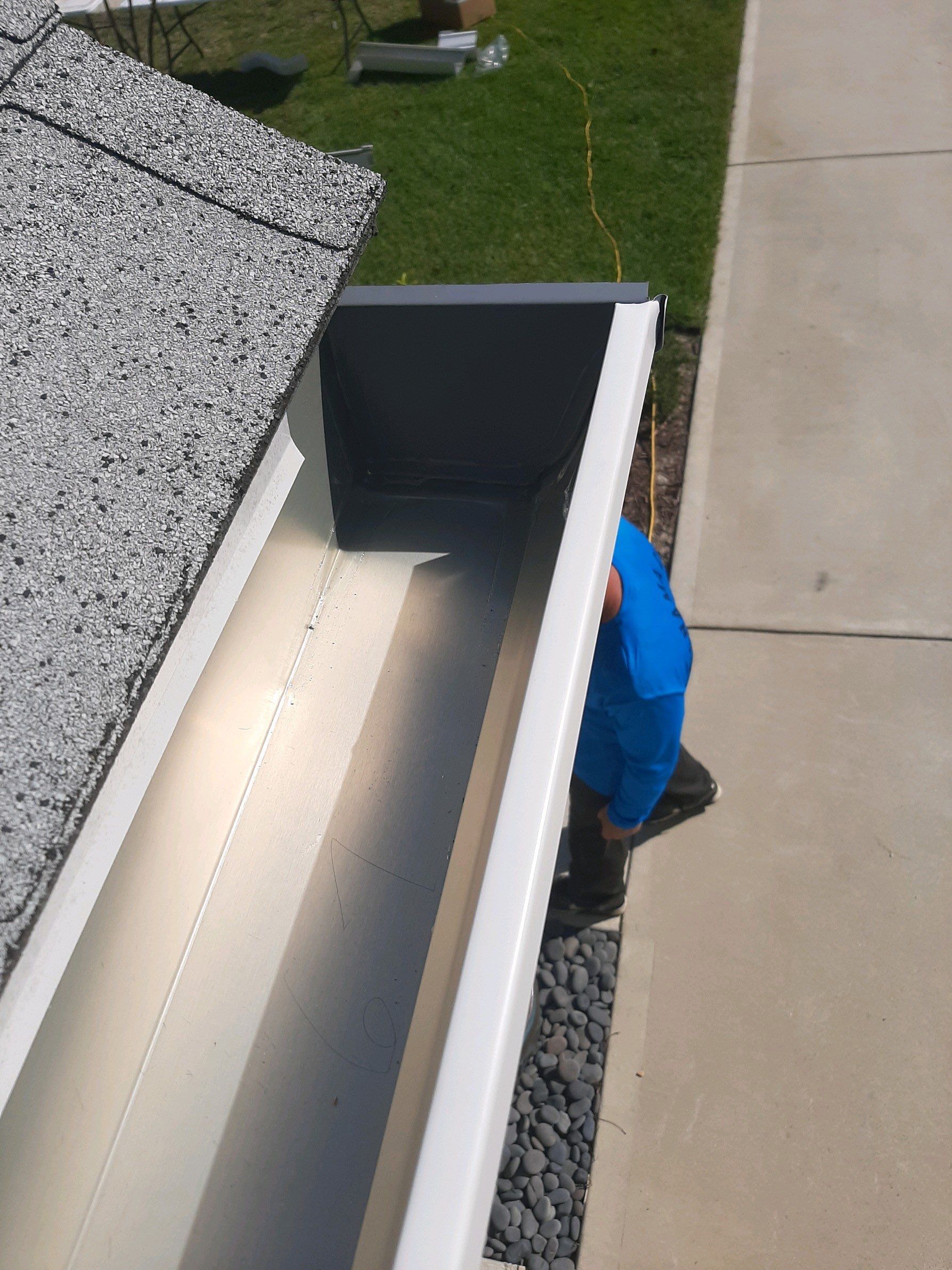 Seamless Gutter Installation using White by Gutter Professors