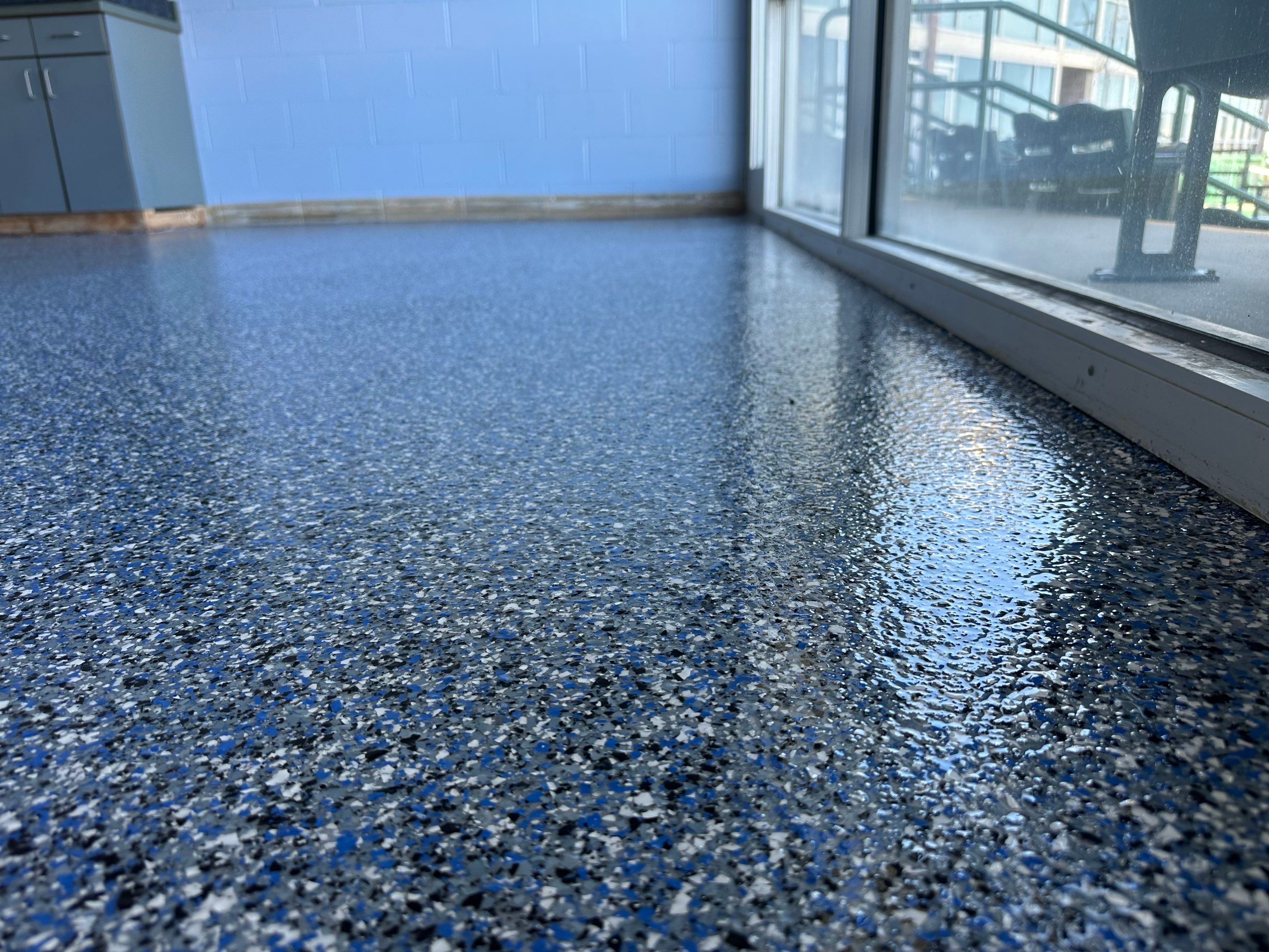 Commercial Epoxy Floor Coating for Stadium Viewing Suites in Sioux Falls by Select Painting, Coatings & Garage Cabinets