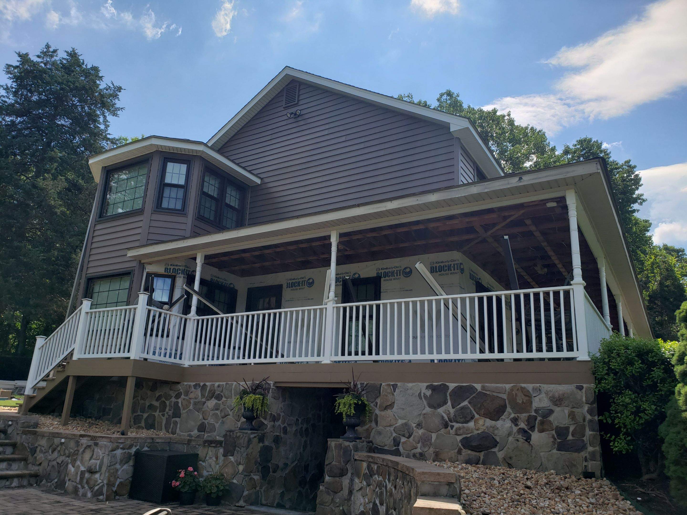 Exterior remodel including window replacement by American Home Contractors