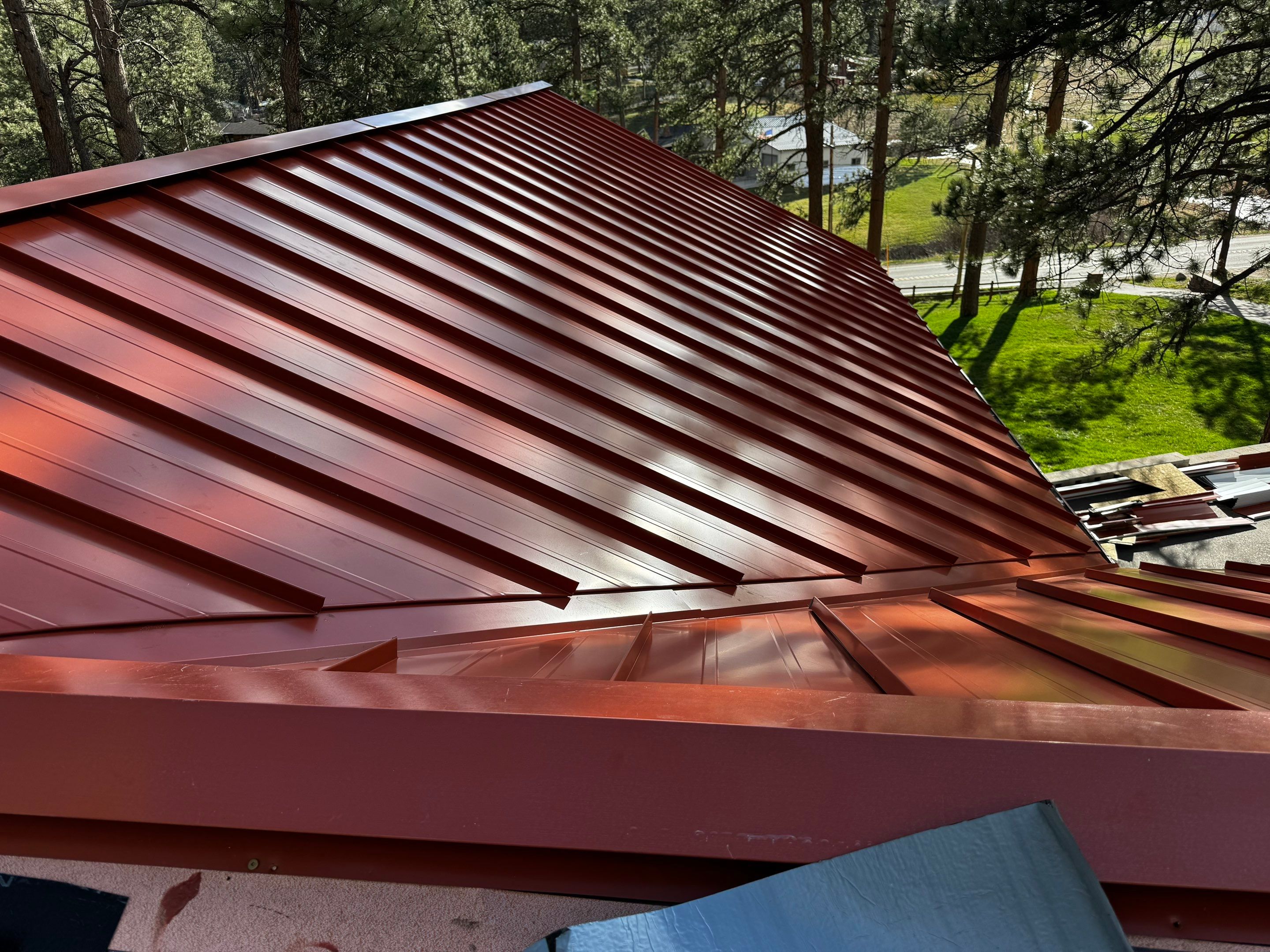 Residential Roofing Installation using Standing Seam Metal by Blue Peaks Roofing LLC 