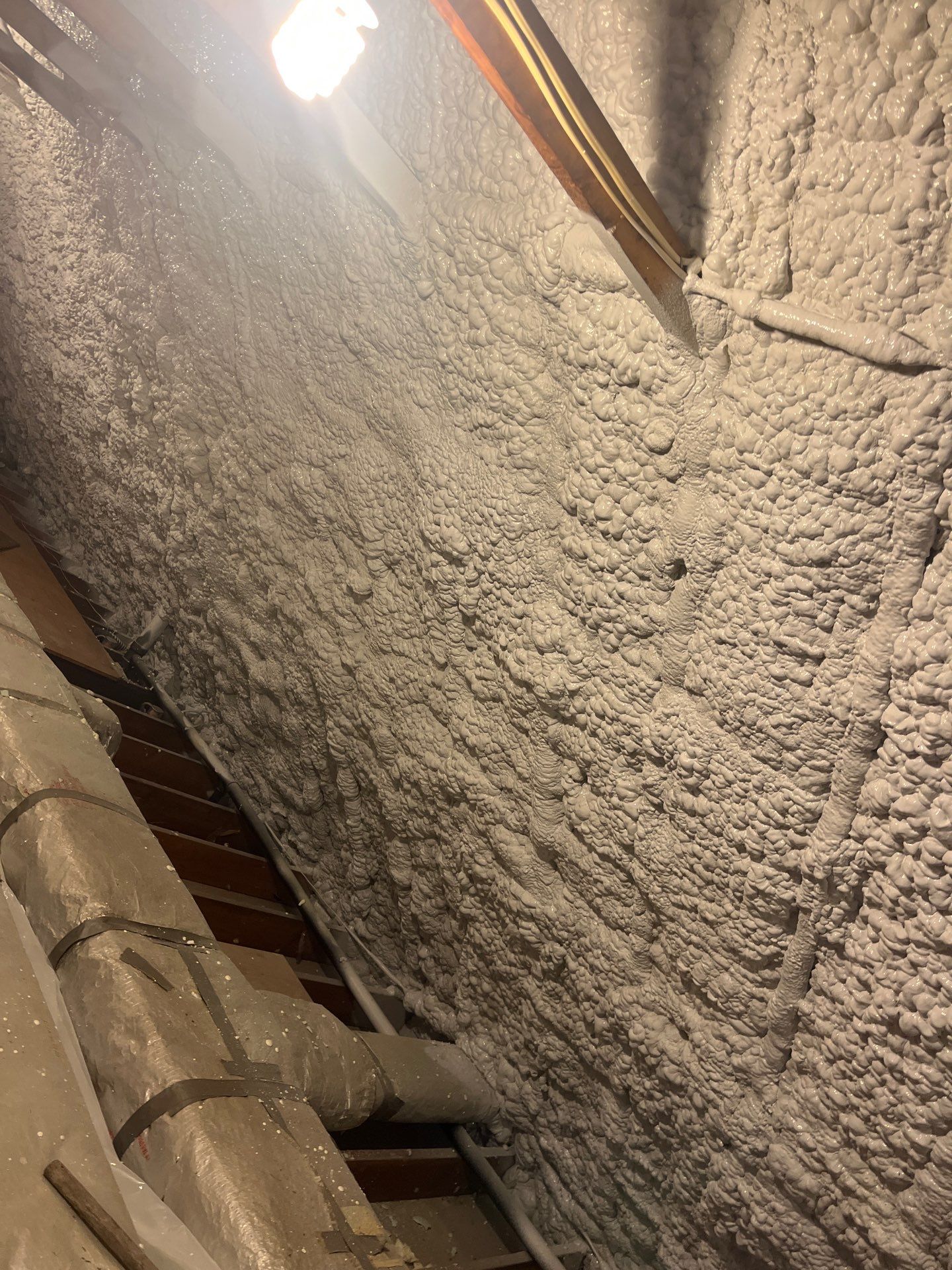 Attic Retrofit using open cell spray foam by NYS Foam & Energy