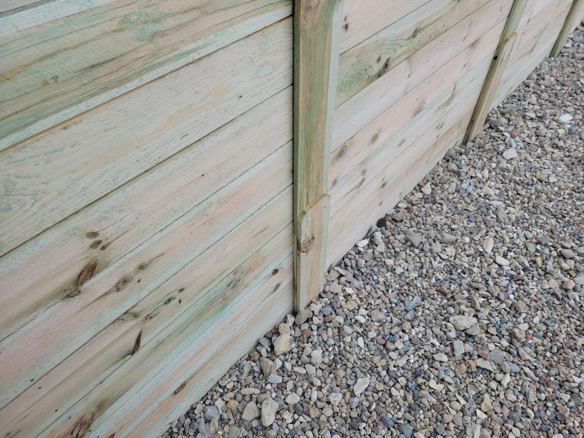 Modern Horizontal Slat Wood Privacy Fence Installation in Cedar Falls by Perfect Picket Fence and Stain