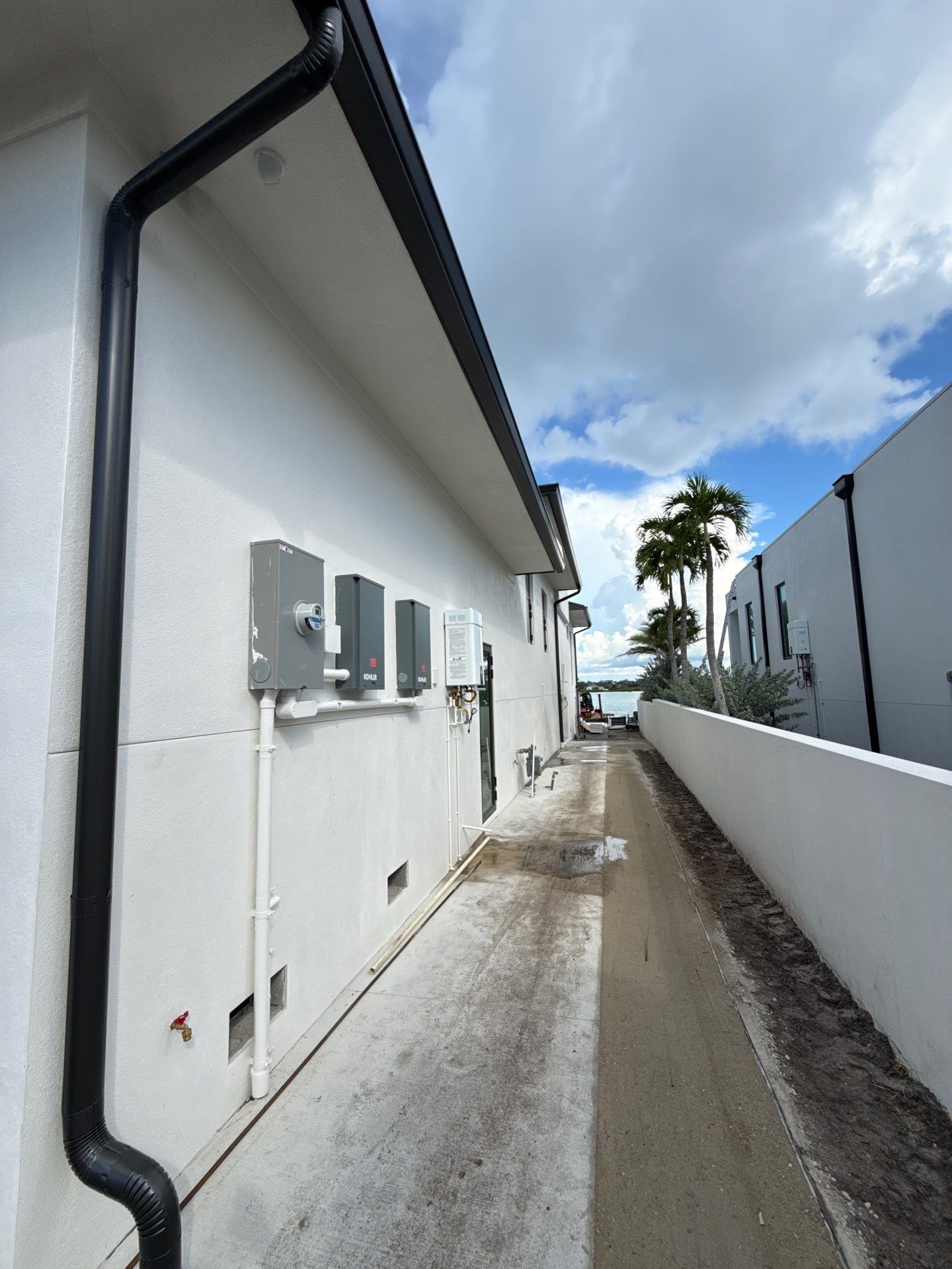Seamless Aluminum Gutter Installation using black seamless gutters in Sarasota FL by Gutter Professors