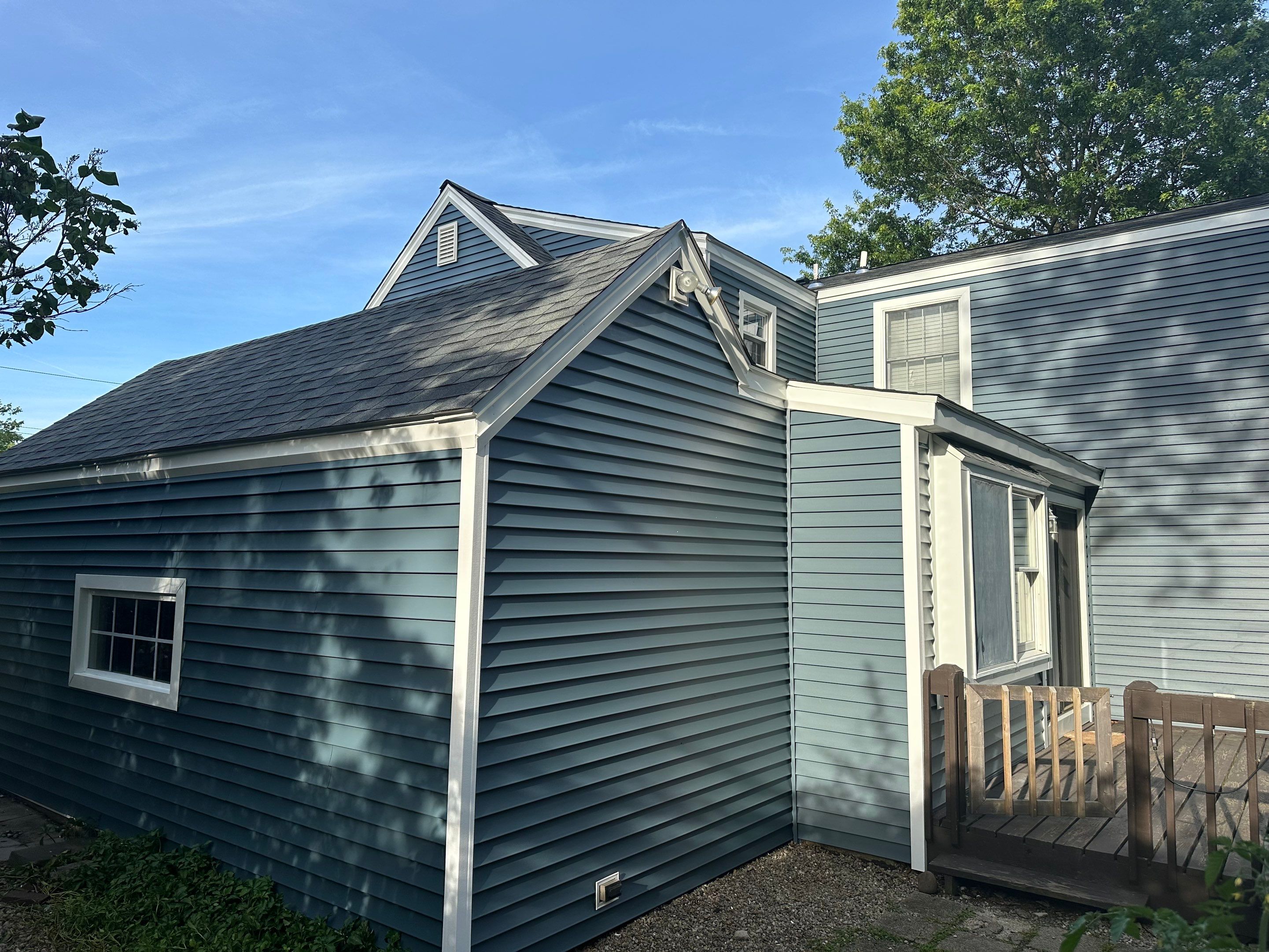 Complete Exterior Estate gray with Pacific Blue Siding by A Plus Exterior