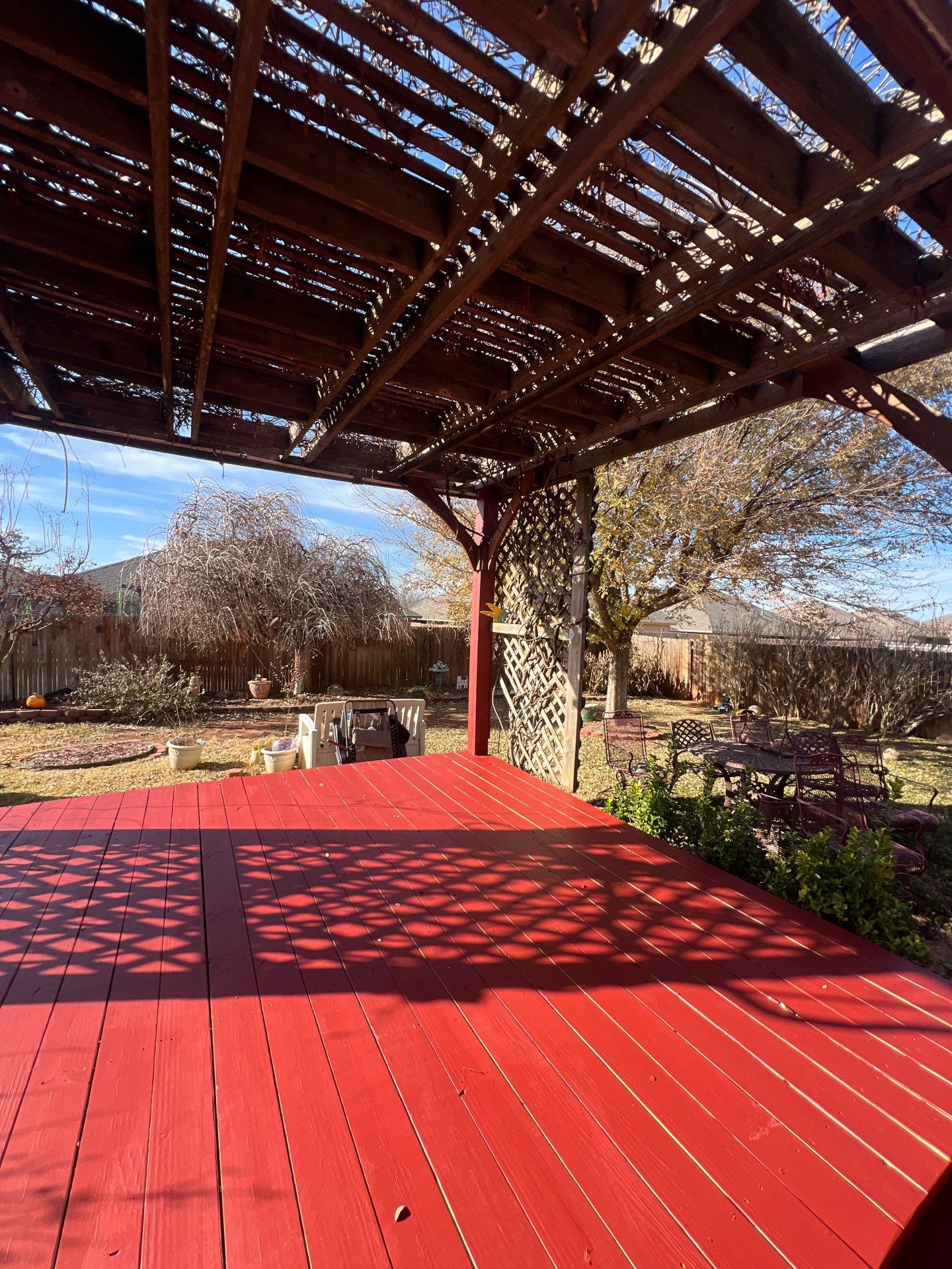 pergola installation and painting in Yukon by McCann's Roofing and Construction