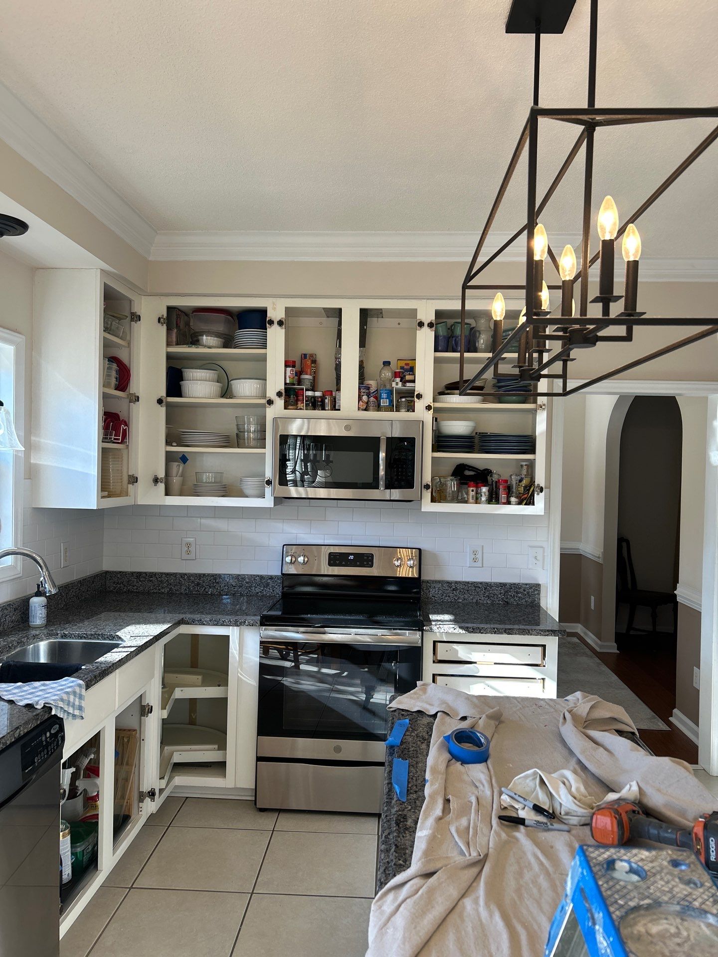 Cabinet painting by GonzalezPainters & Contractors Inc 