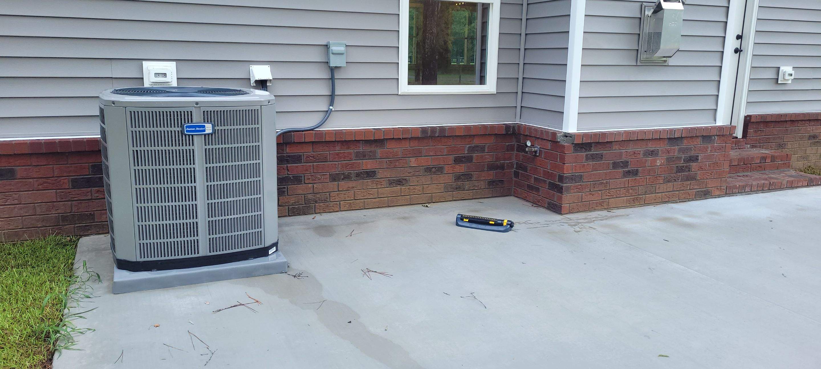 New Home Construction using brick and vertical vinyl by Cornerstone Home Builders, LLC