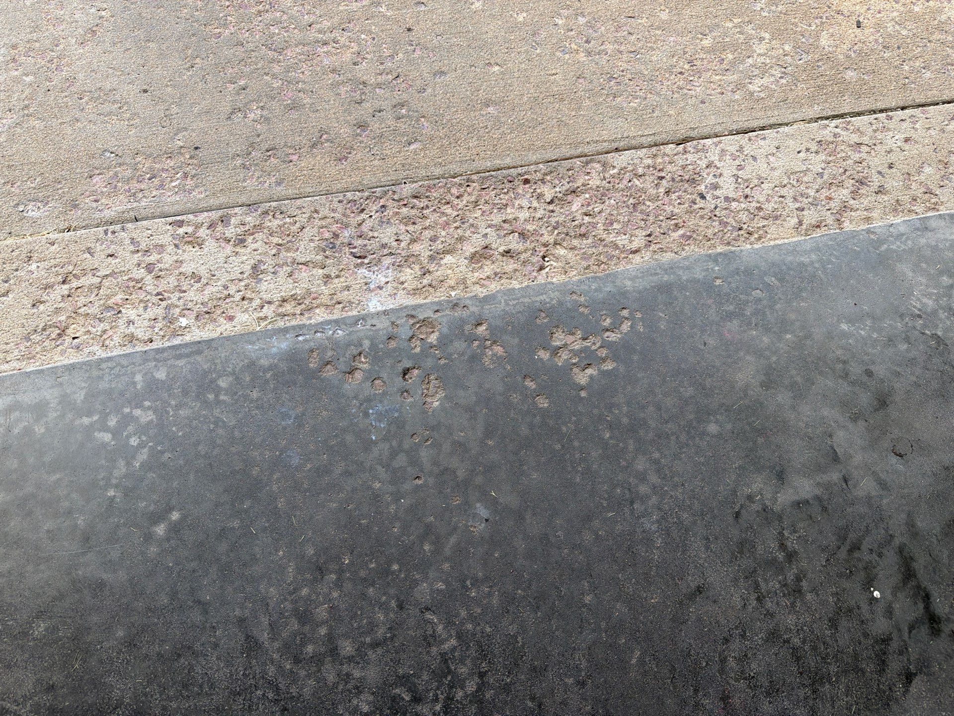 Cabin FEver Flake Garage Floor Coating Installation in Sioux Falls by Select Painting, Coatings & Garage Cabinets