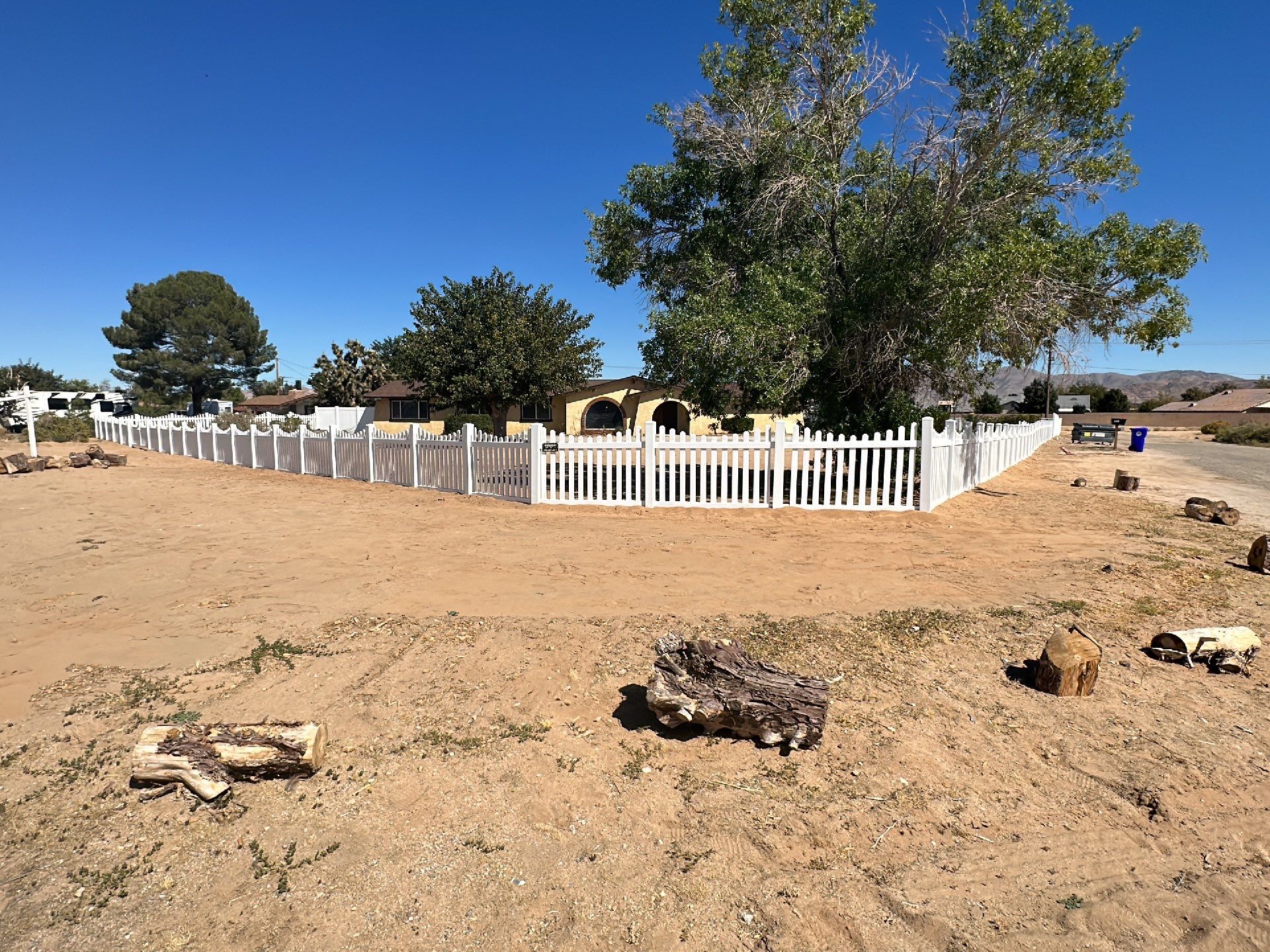 White picket fence  by Fence Guys Inc. 