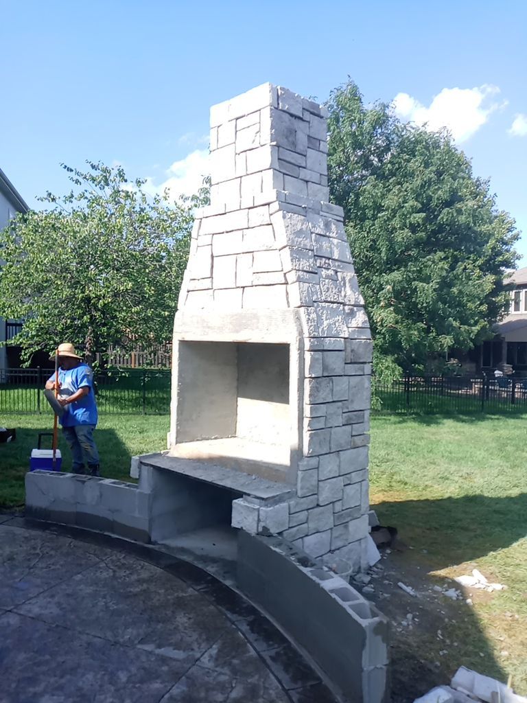 Back Yard Fireplace and Landscape by LAND ESCAPES LLC
