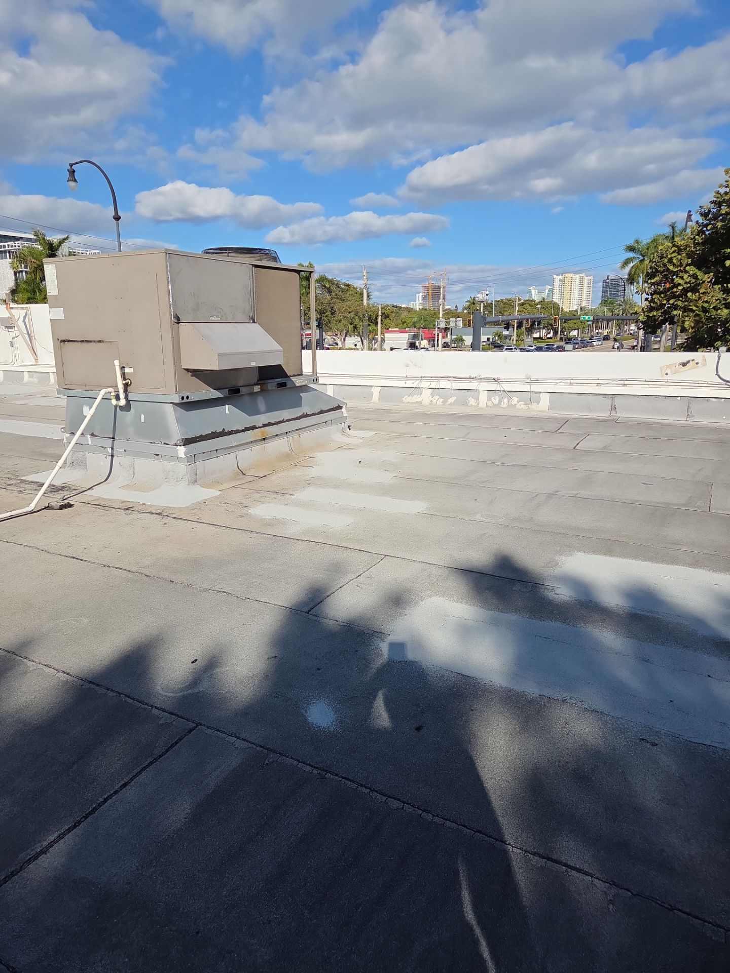 Commercial Flat Roof Restoration Using Silicone Coating in Hallandale Beach by Aastro Roofing