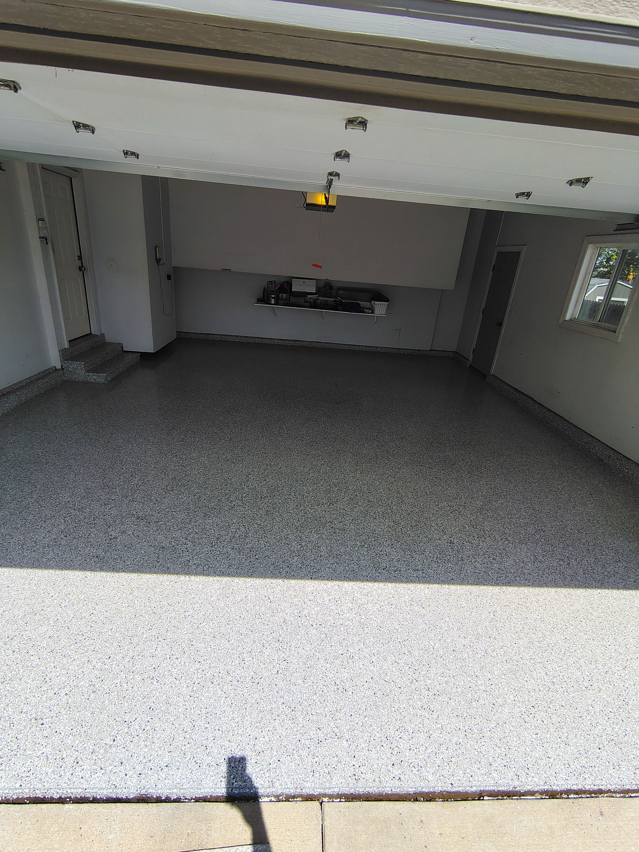 Decorative Chip Epoxy Garage Floor Coating in Sioux Falls by Select Painting, Coatings & Garage Cabinets