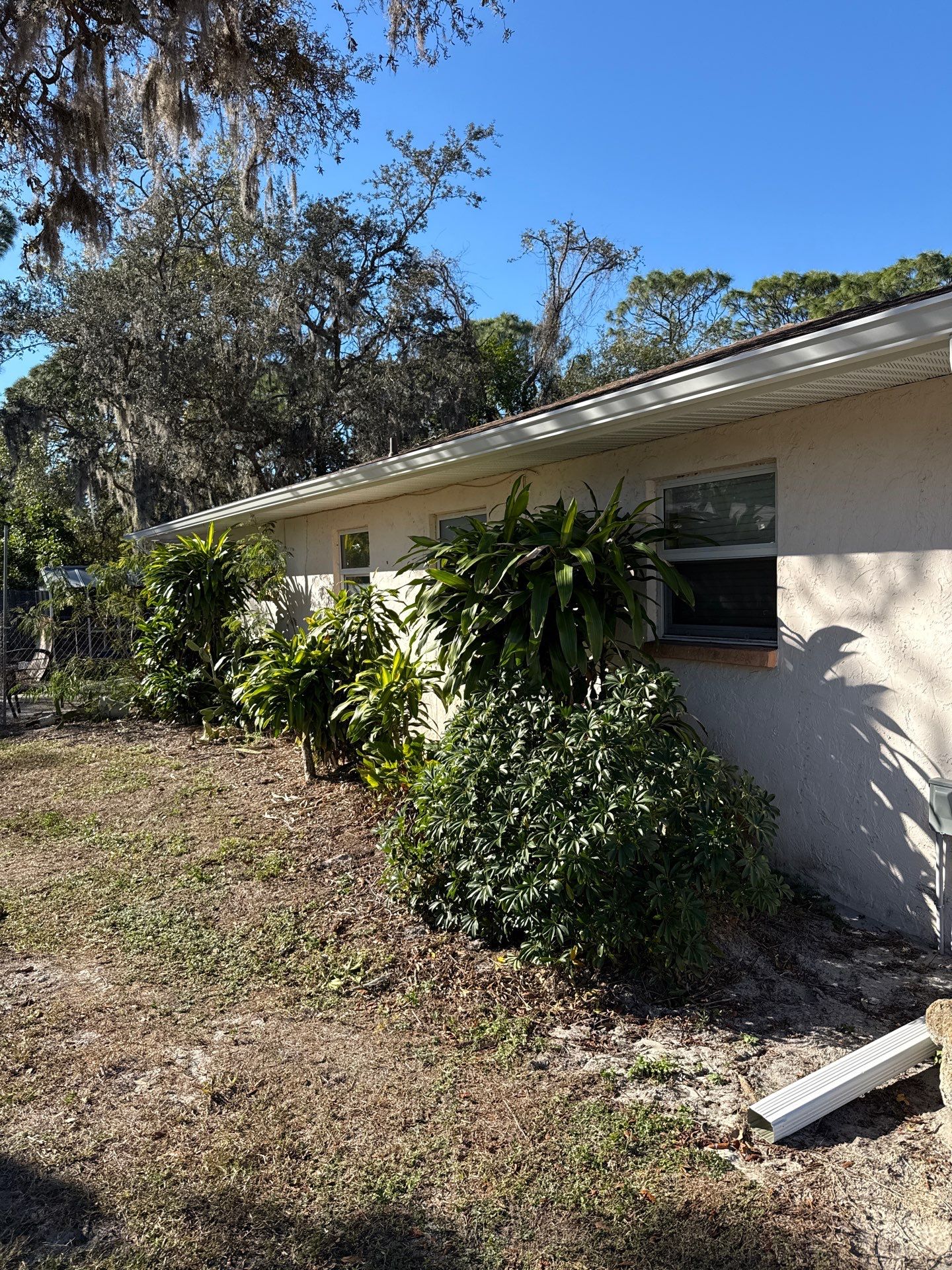Downspout Installation using White Down Spouts in Sarasota FL by Gutter Professors