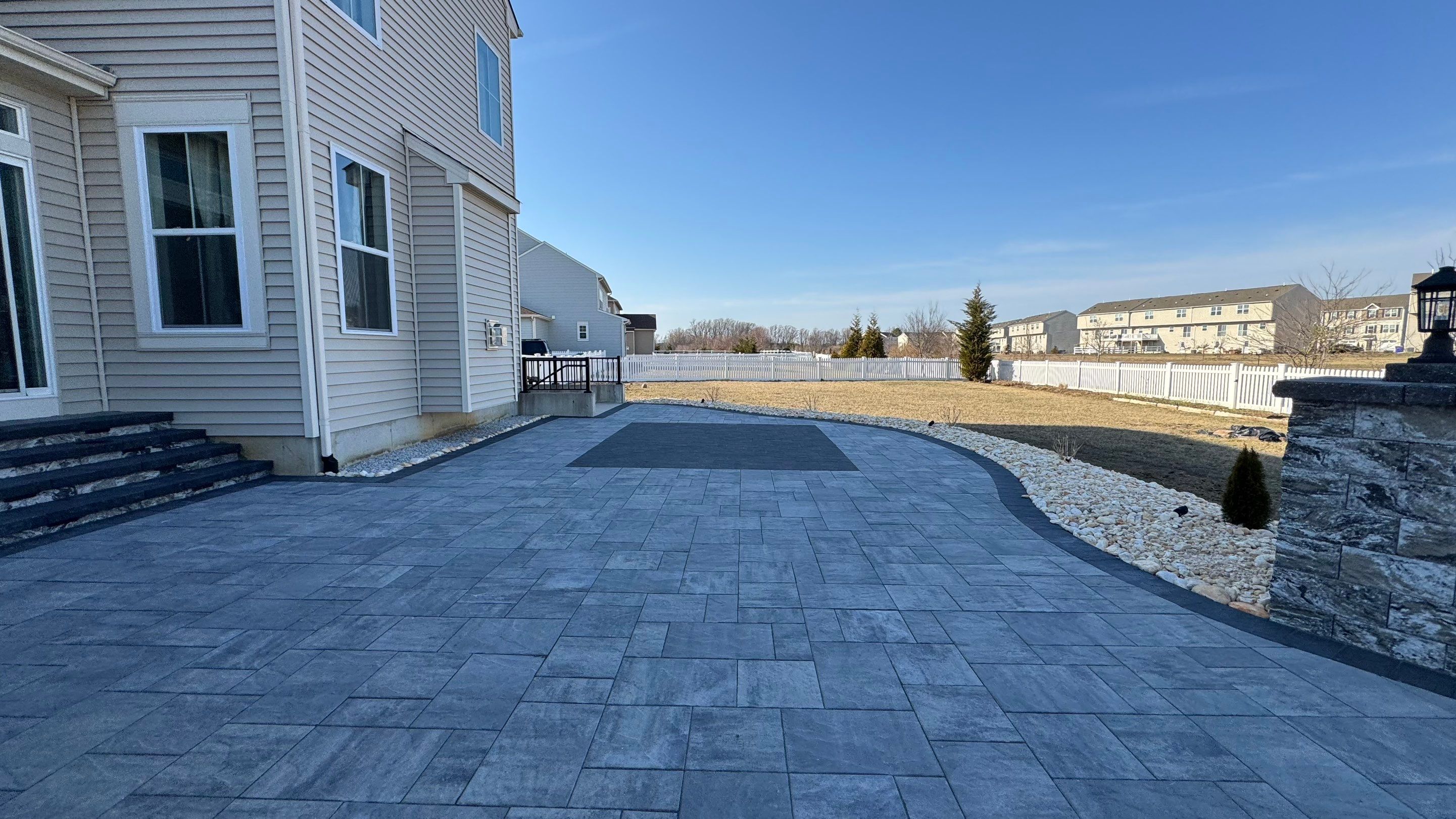 Custom Belgard patio by Studio G Indoor Spaces & Outdoor Living