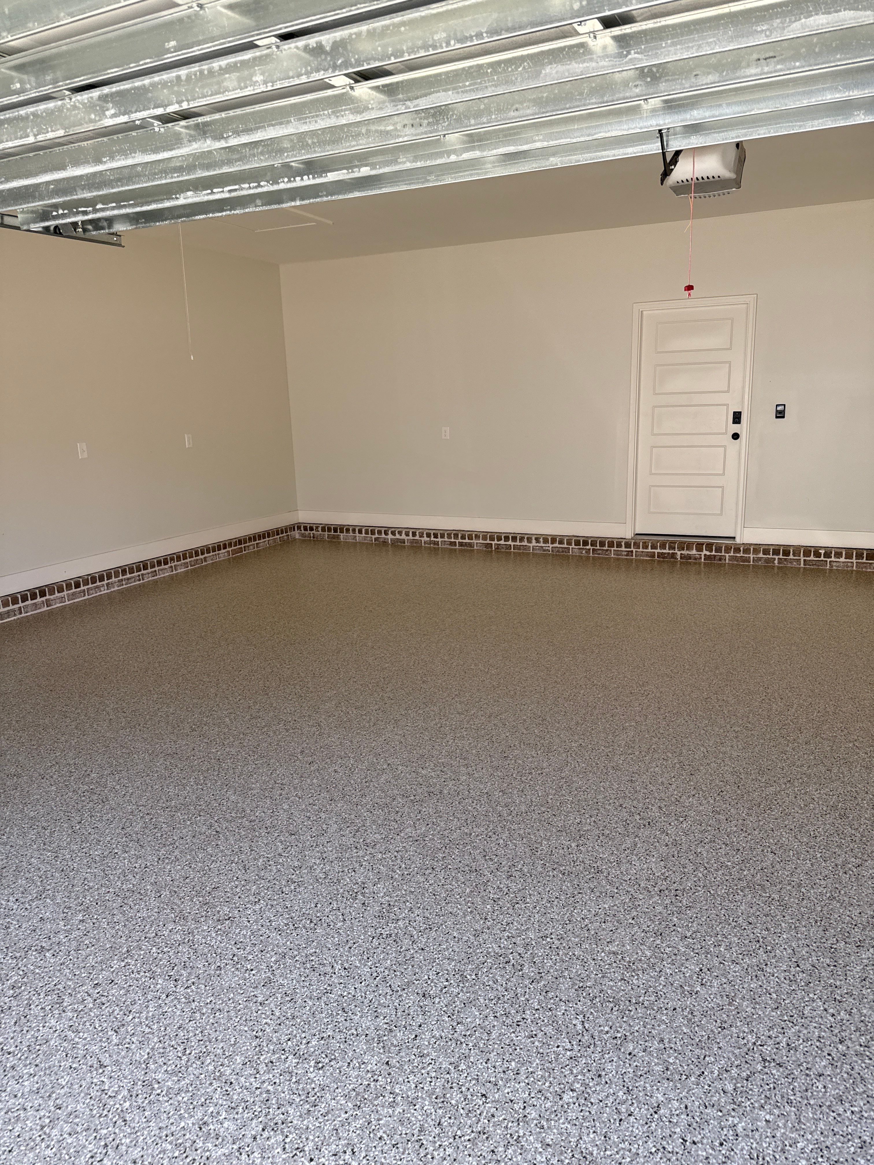 Decorative Stained Concrete Overlay and Garage Floor Coating in Mobile by Cornerstone Hard Surface Restoration 