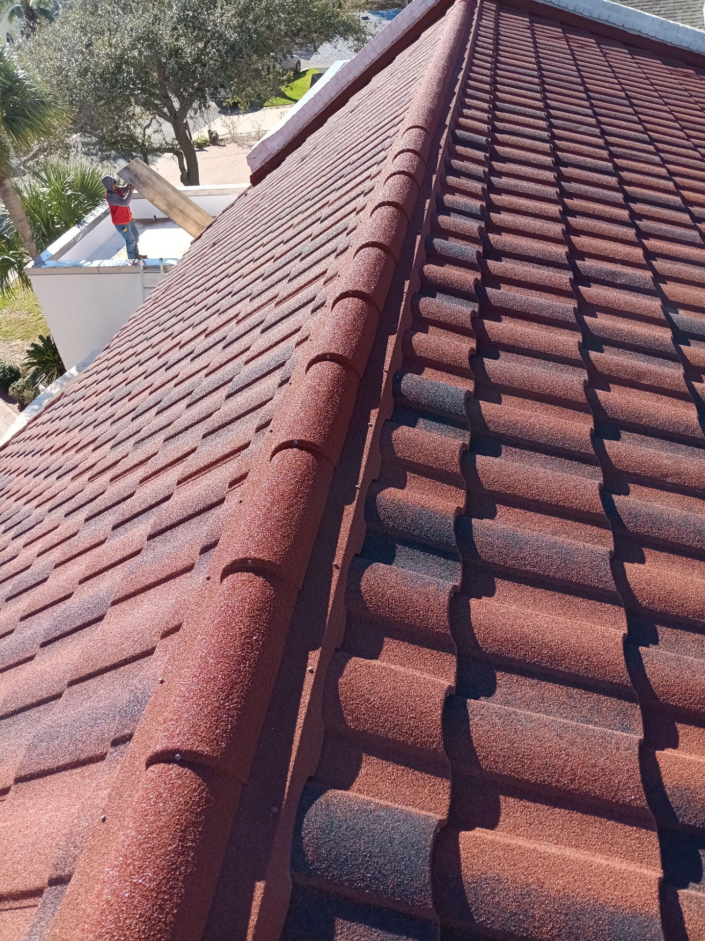 Off with the Tile and on with the TILCOR stone coated metal.  by Bayfront Roofing and Construction