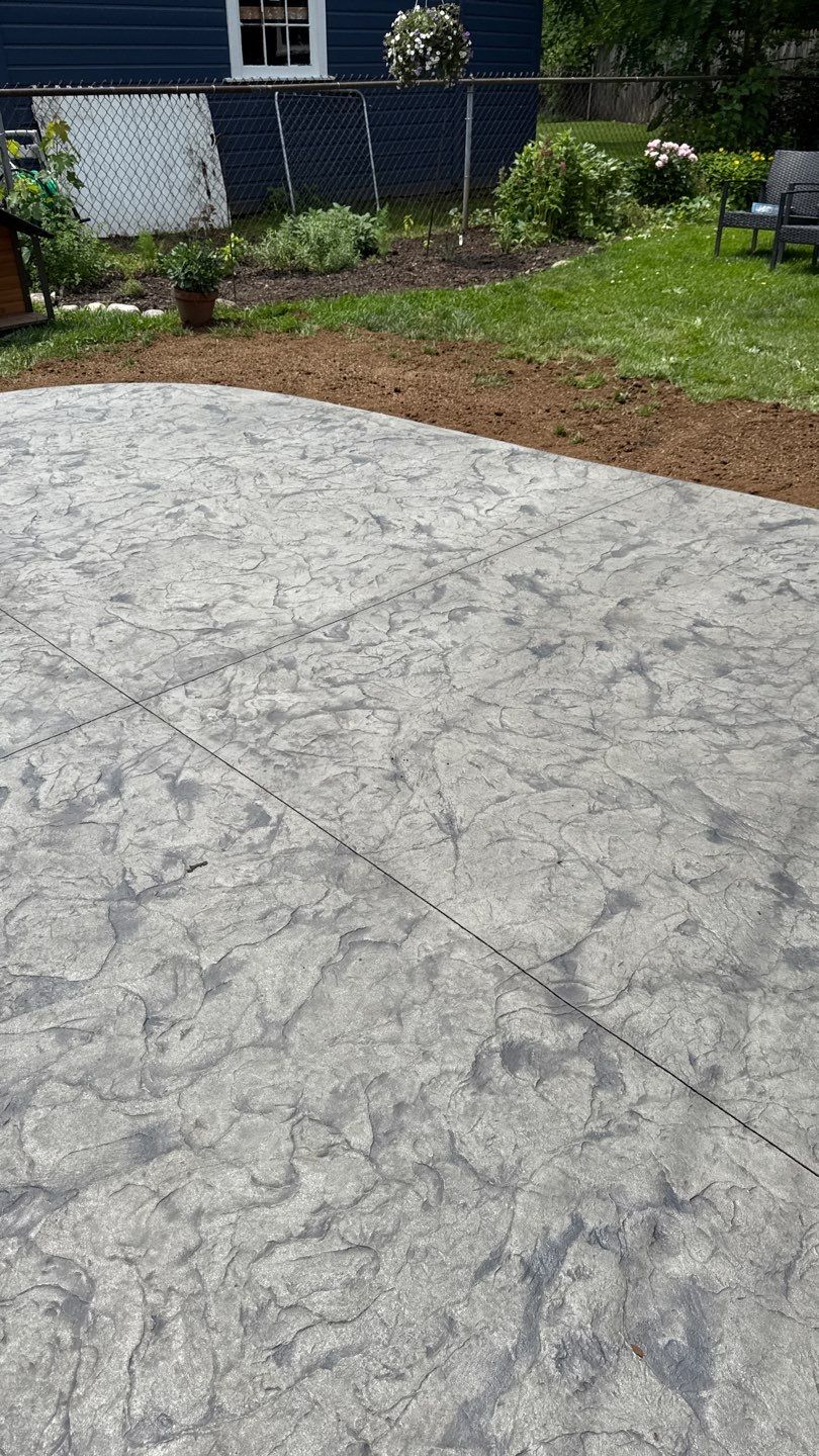 Oxford slate stamped patio and walkway  by NG Masonry & Construction LLC