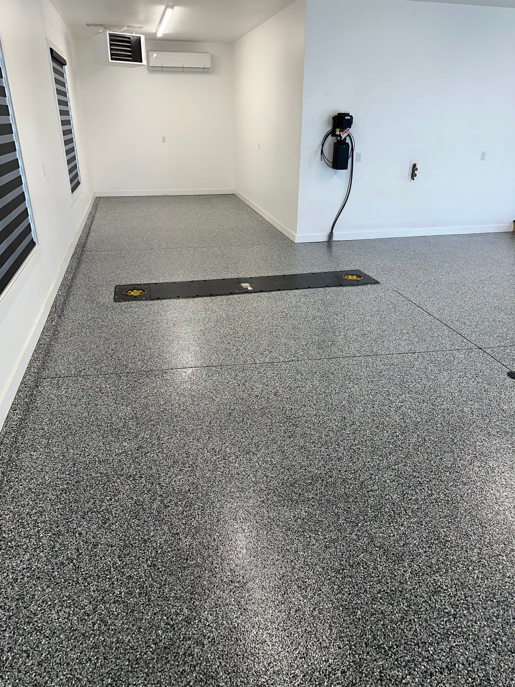 Multi-Color Epoxy Flake Garage Floor Installation in Sioux Falls by Select Painting, Coatings & Garage Cabinets
