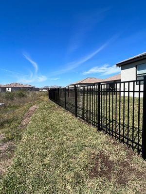 Aluminum Fence Installation using Black 3 Rail Aluminum Fence