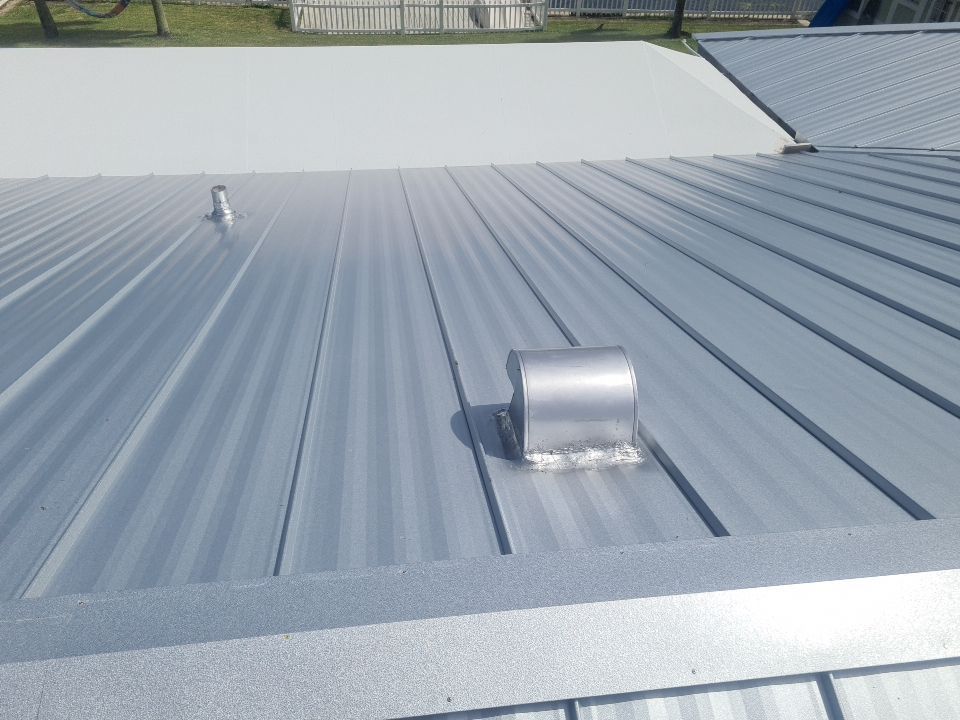 Residential Roofing Installation using 1" Nail strip metal roof by BLUES BROTHERS CONSTRUCTION CORP