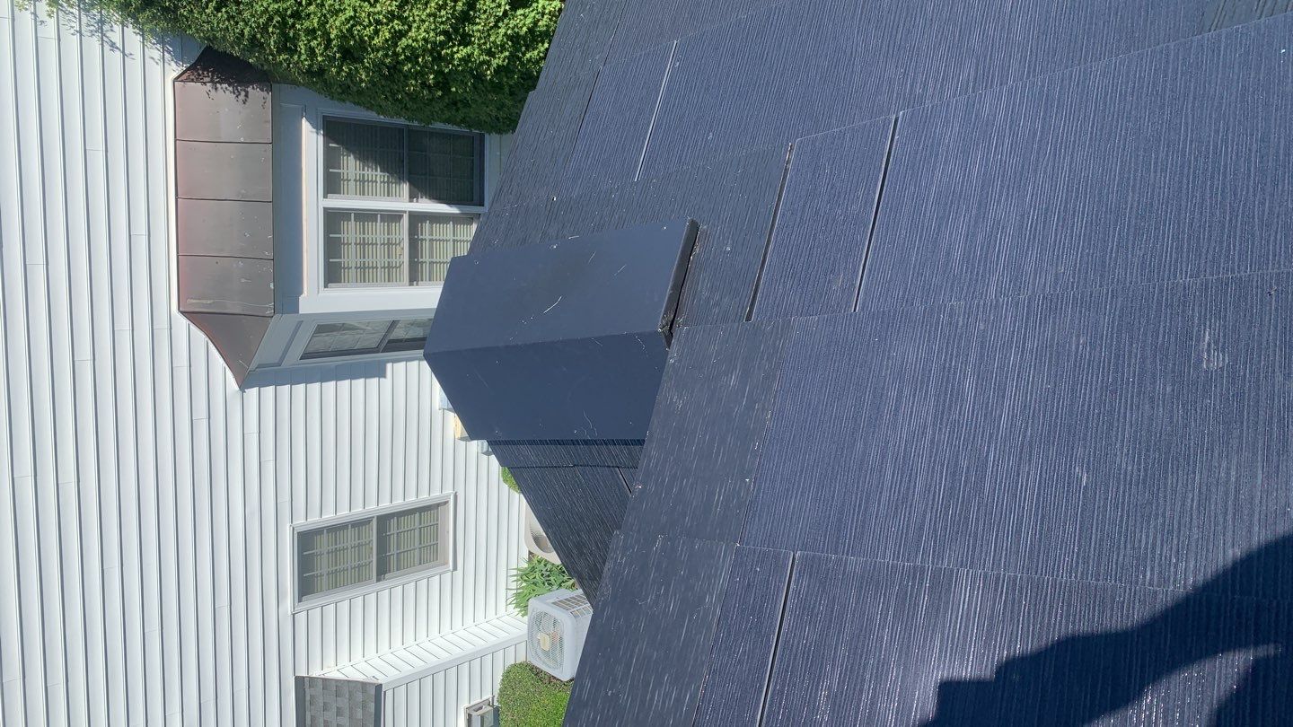 Tesla Solar Roof Replacement using Tesla Solar Roof V3 tiles by American Home Contractors
