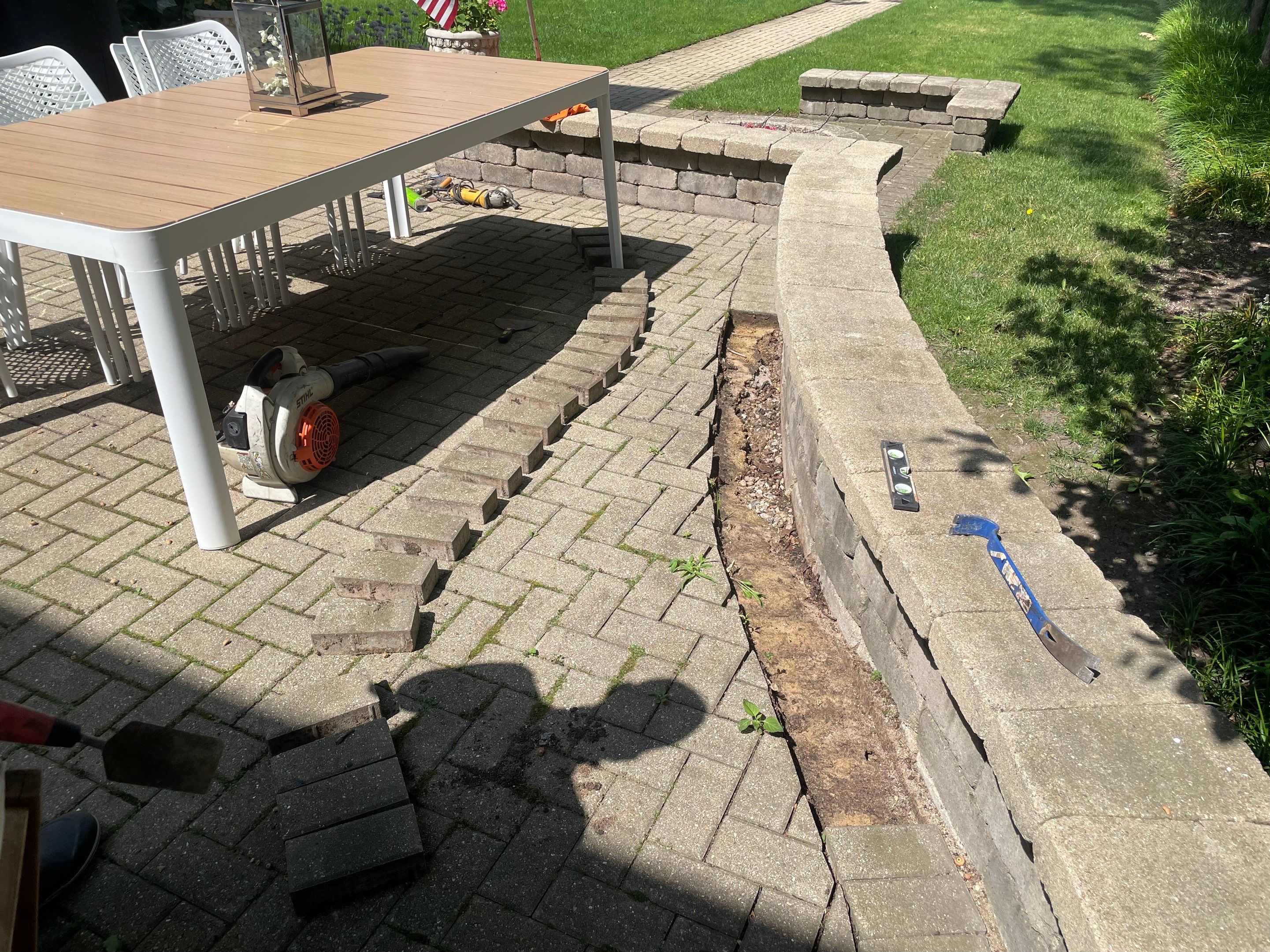 Brick patio repair, clean sand and seal by Northern Power Washing LLC.