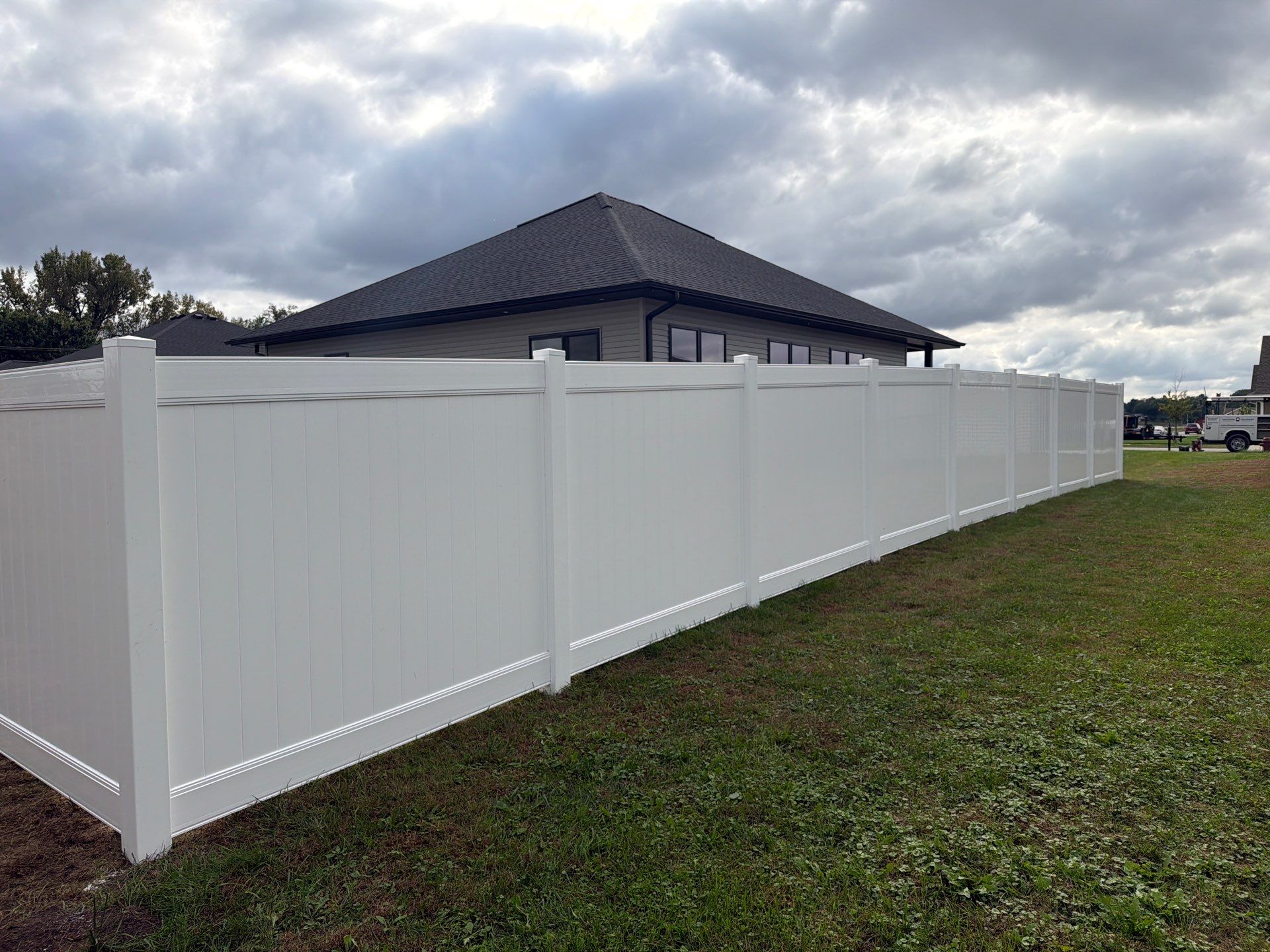 Residential White Vinyl Privacy Fence Installation in Janesville by Perfect Picket Fence and Stain