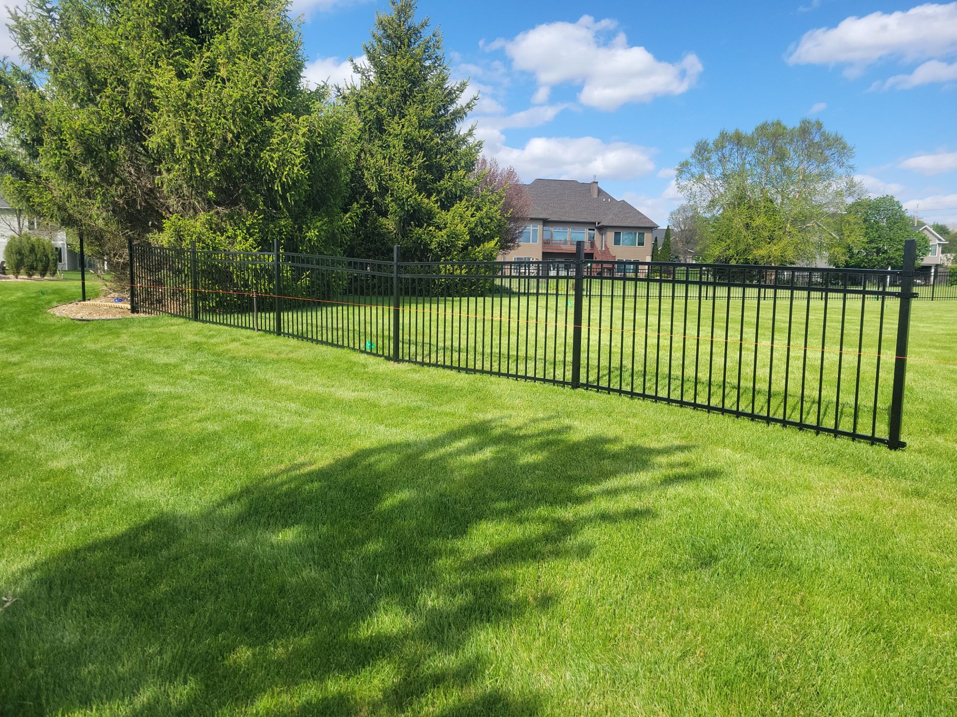 Black Ornamental Metal Picket Fence Installation in Waterloo by Perfect Picket Fence and Stain