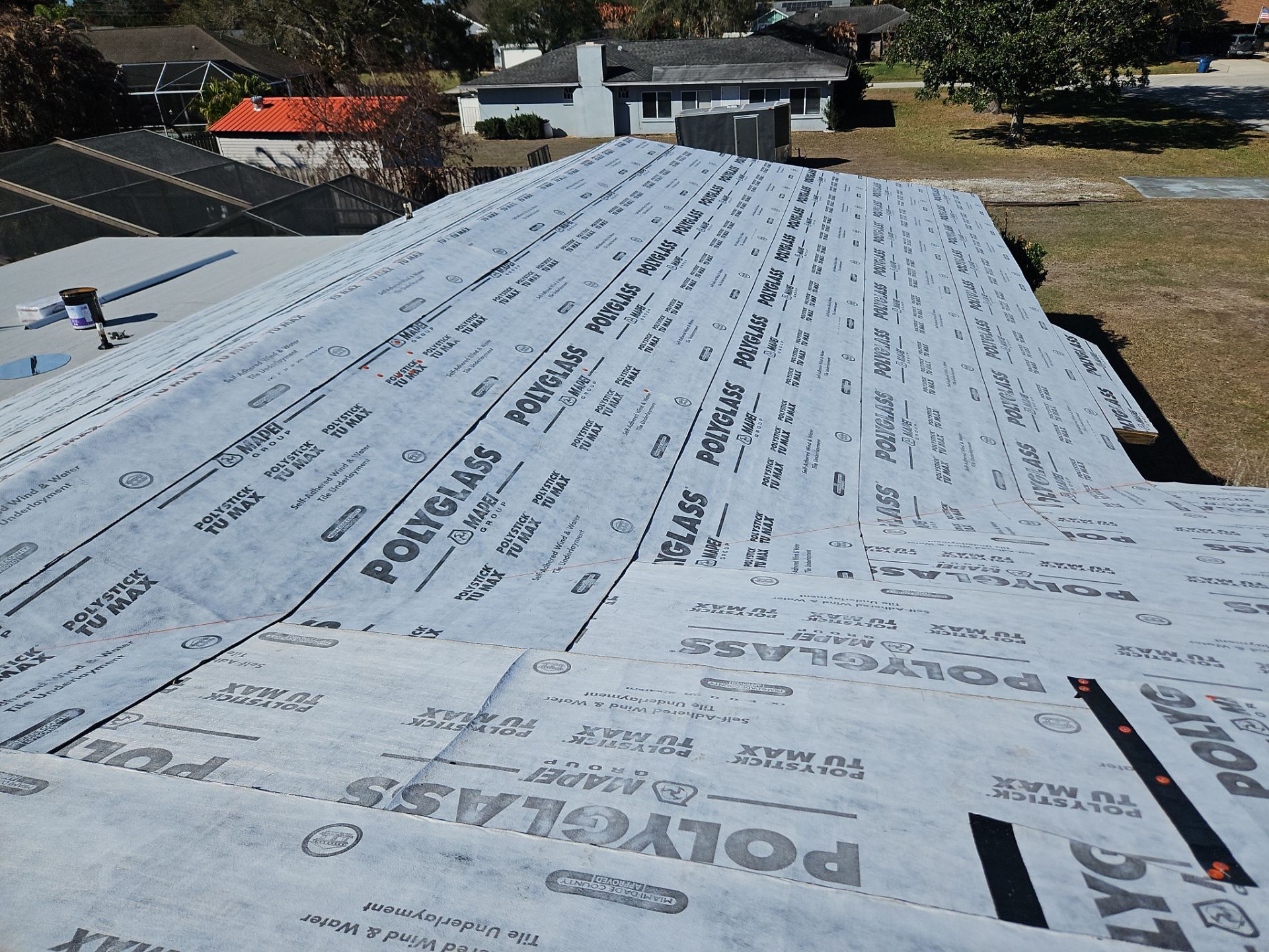 White Standing Seam Metal Roof Replacement and Hurricane Reinforcement in Palm Bay, Florida by Wiedmann Construction & Roofing