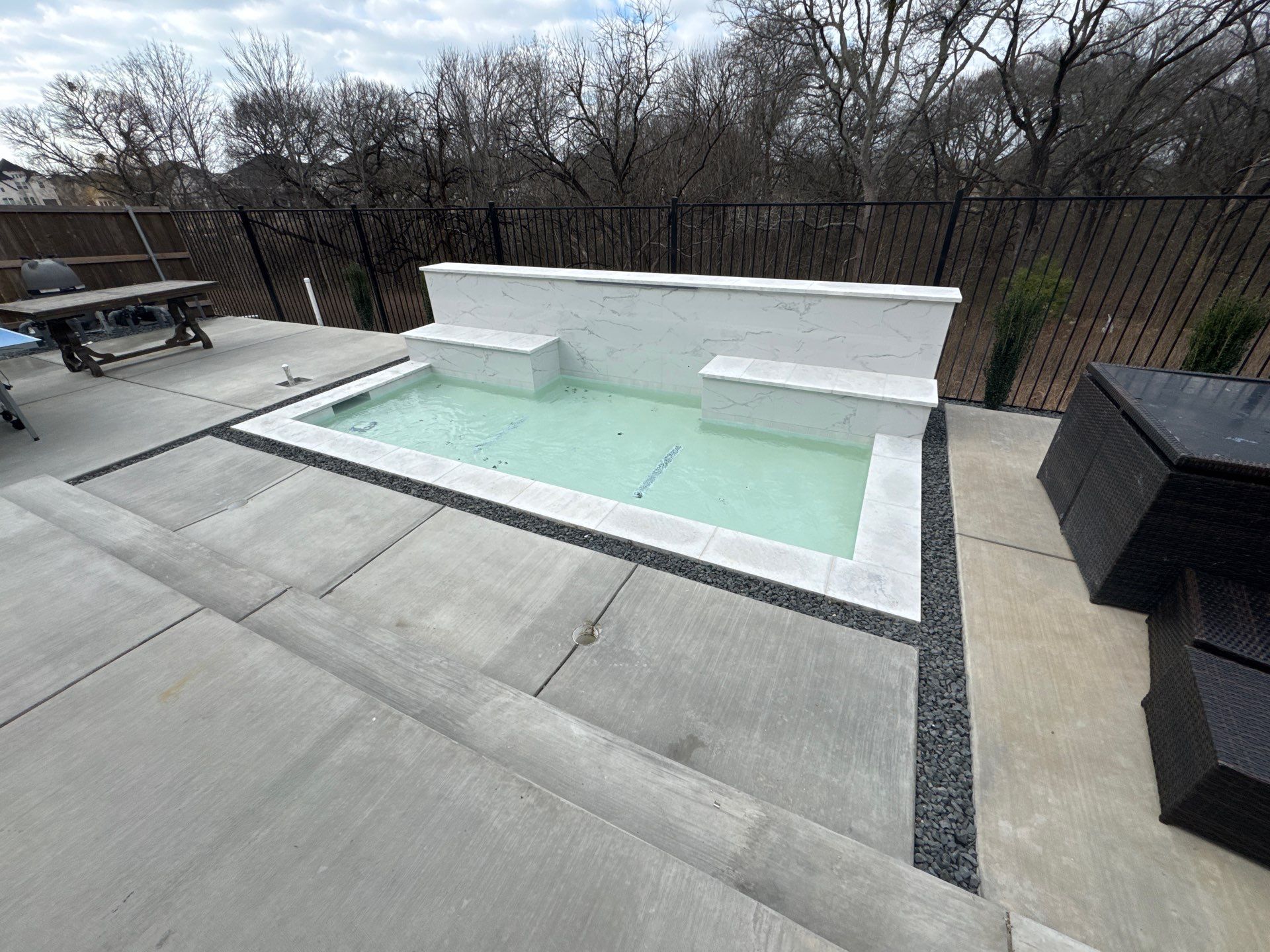 Sleek Modern Pool with Raised Back Wall by Pinnacle Pools and Spas - DFW