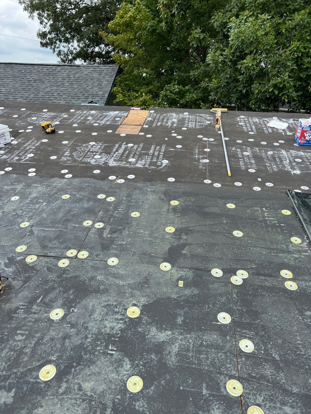 Residential Roofing Installation using 60 mil rubber roof  by Nitro Roofing and Construction