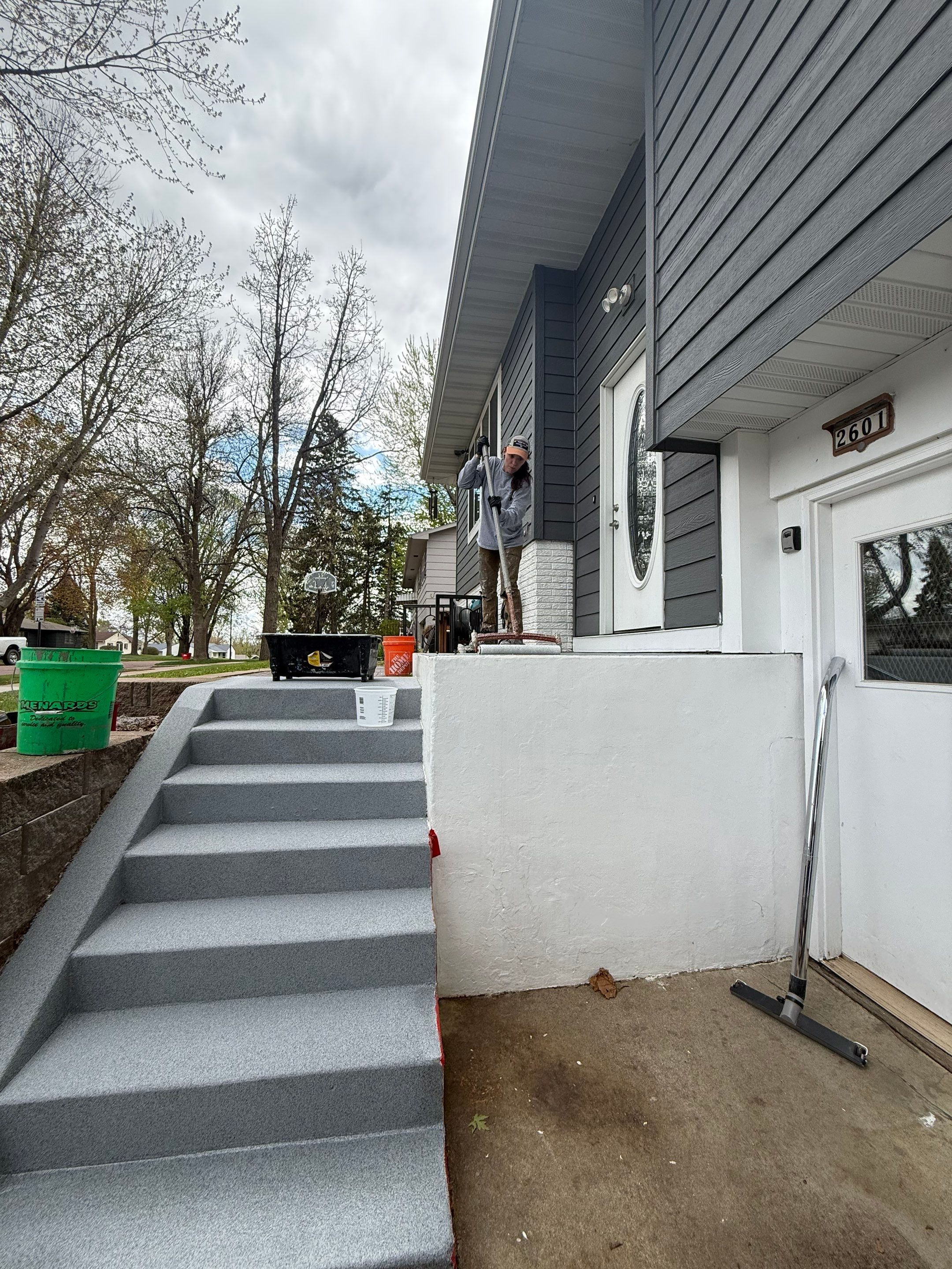 Grey Polyaspartic Porch and Stair Resurfacing in Sioux Falls by Select Painting, Coatings & Garage Cabinets