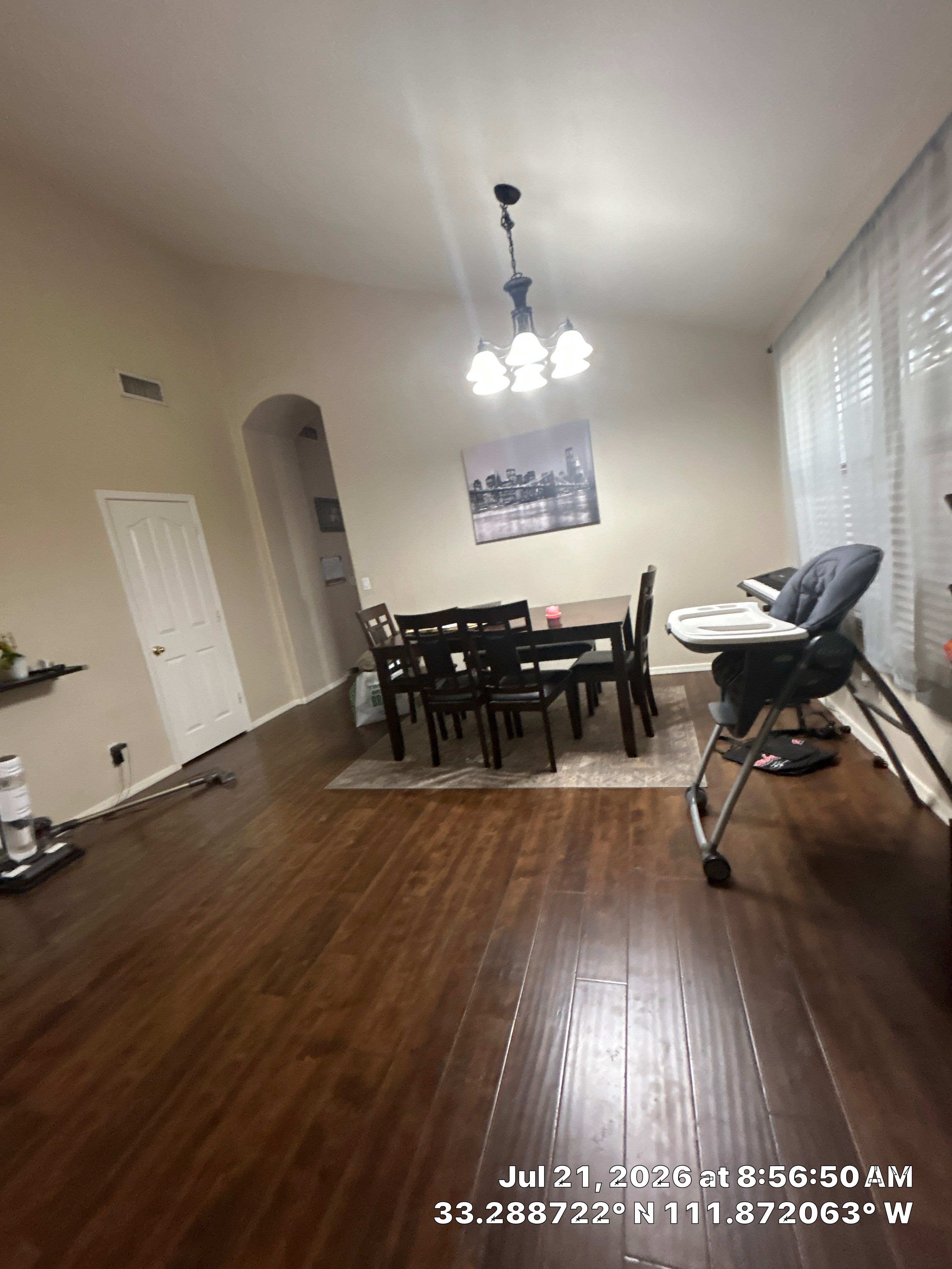 Dark Wood Laminate Flooring Installation in Chandler Dining Room by CompanyCam Sales Demo