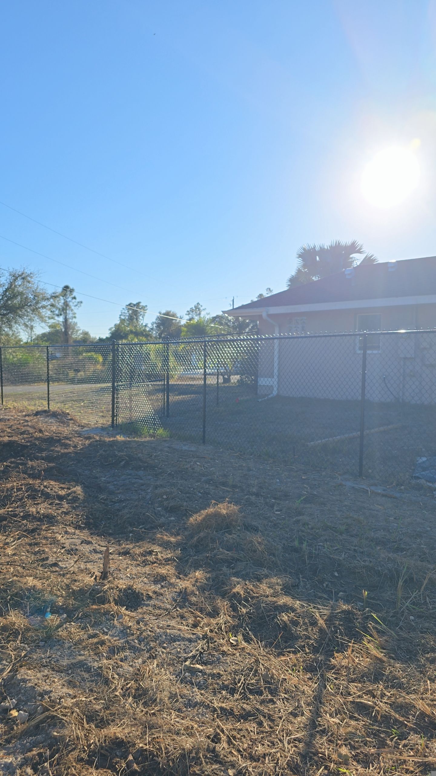 Black Vinyl-Coated Chain Link Fence and Gate Installation in North Port by True Fence LLC